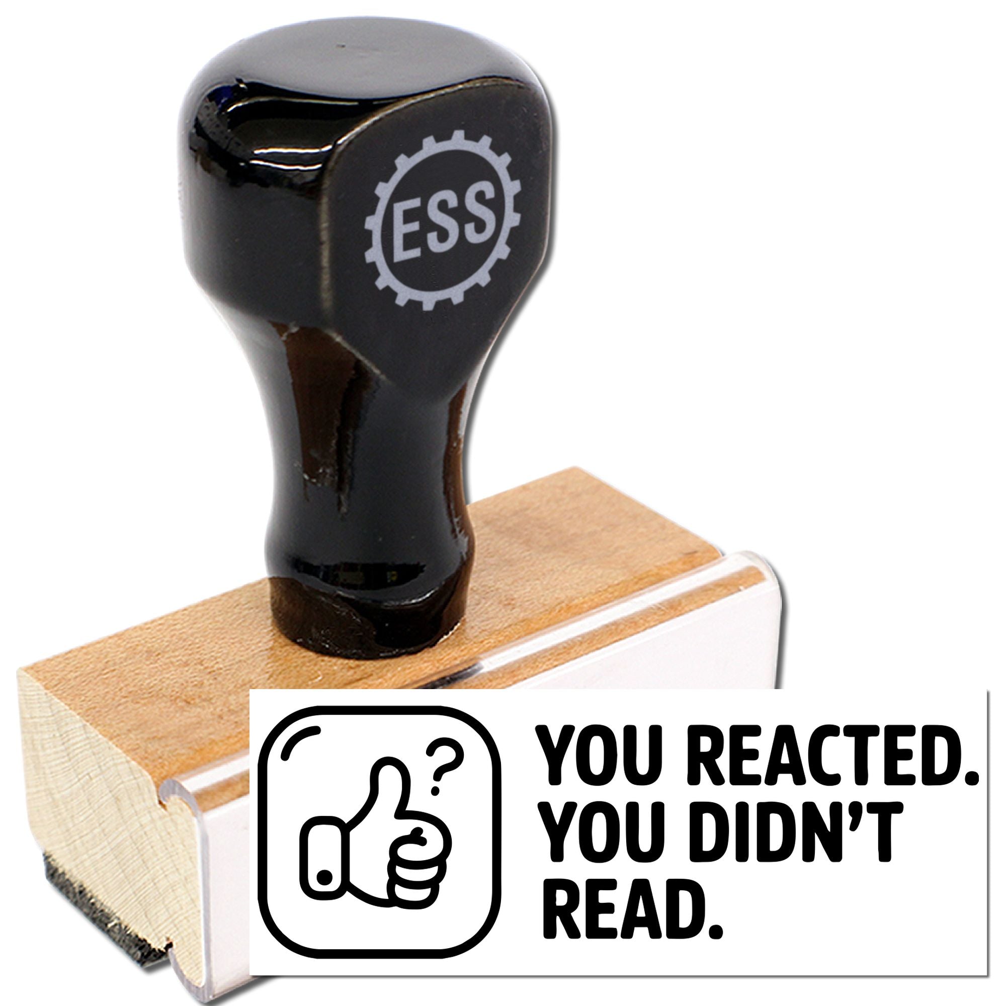 Black ESS stamp and seal product on a wooden base with white label reading You reacted. You didnt read.