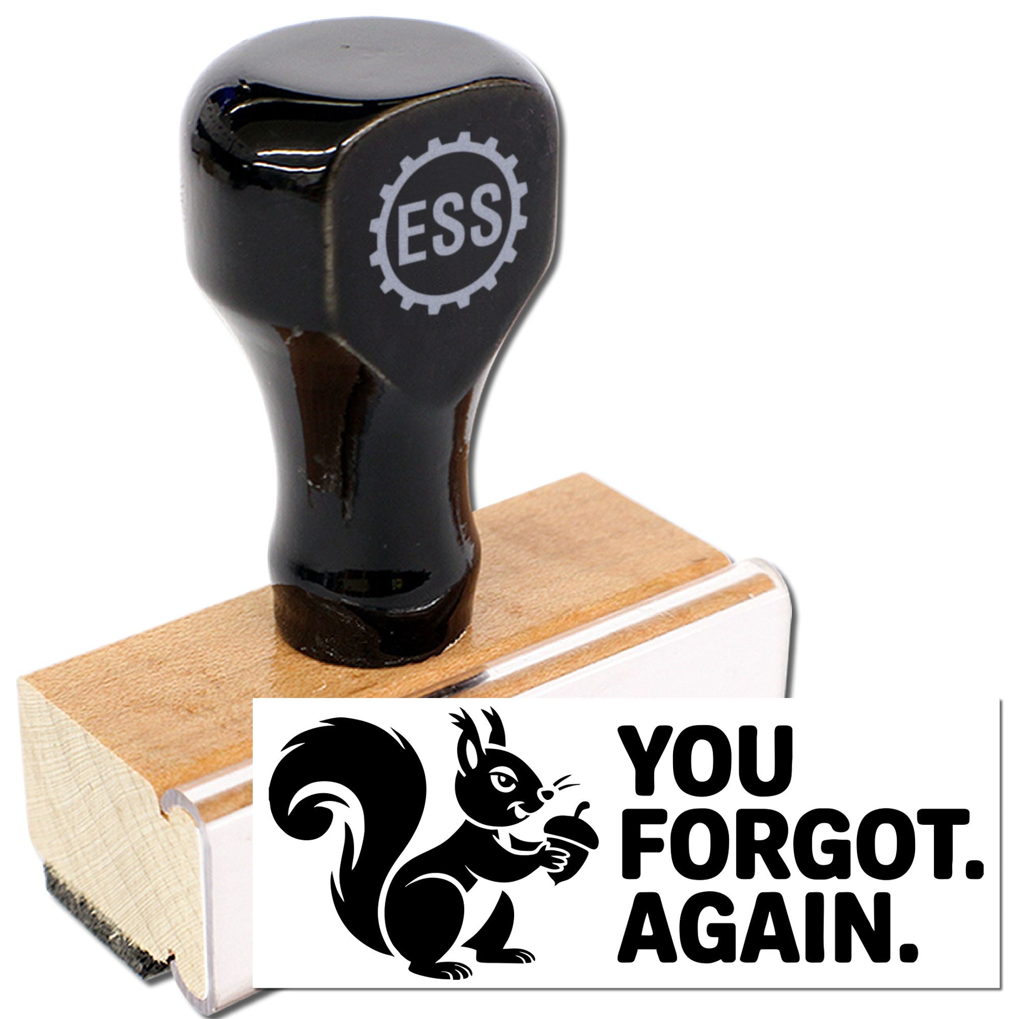 Black rubber stamp seal with ESS gear logo on wooden base, showing a squirrel and bold YOU FORGOT. AGAIN.