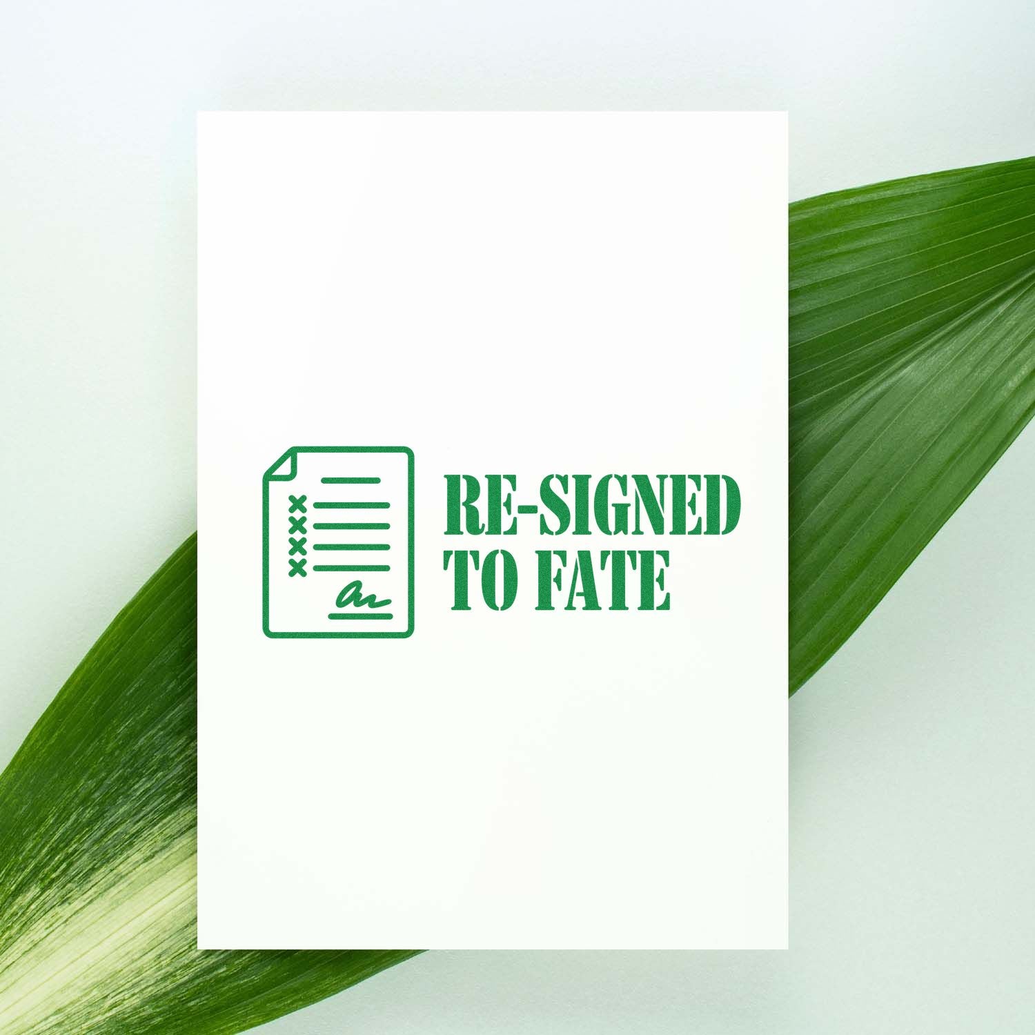 Green stamp seal product reading Re-Signed to Fate with document icon on white card against green leaf background.