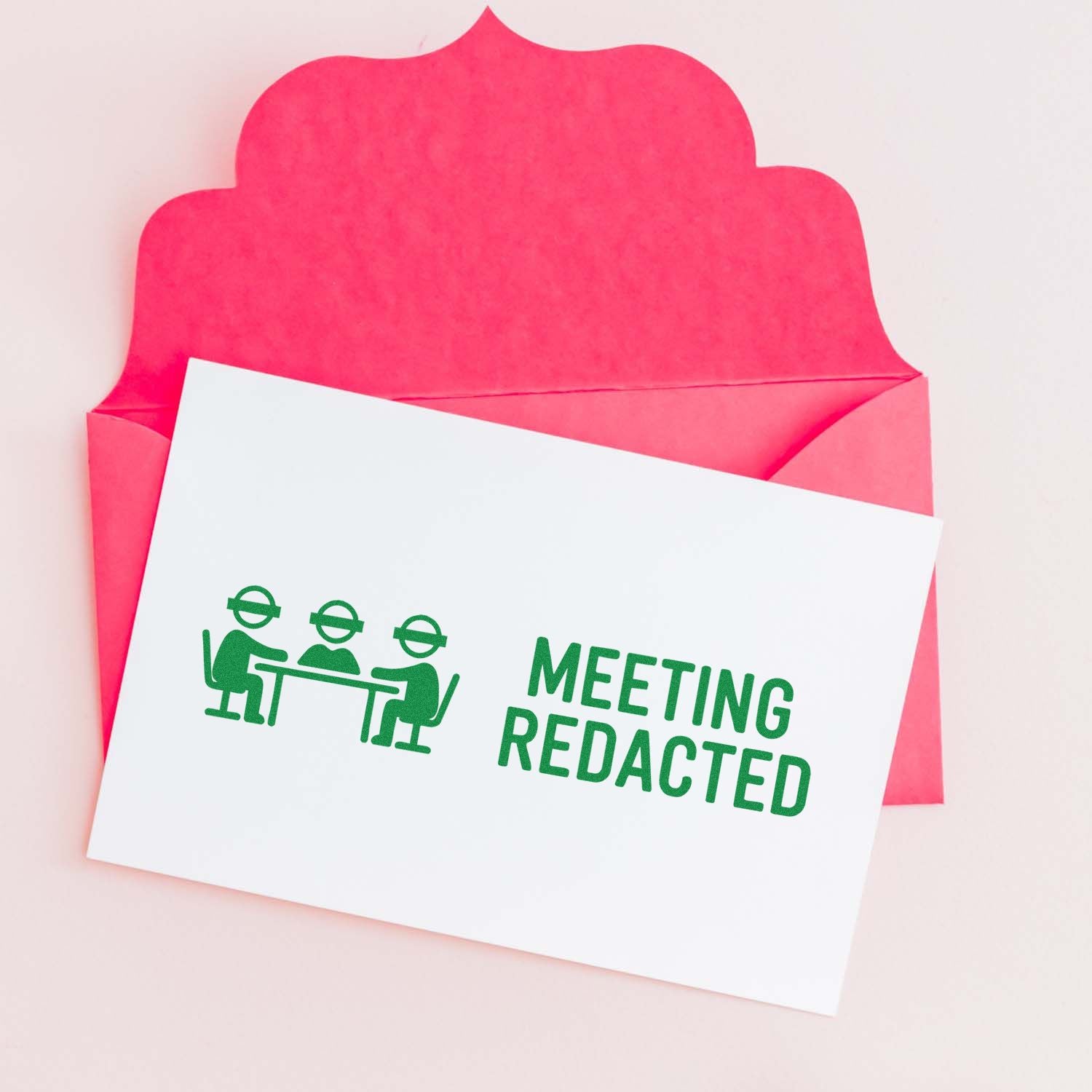 Pink security-style envelope with white card stamped in green MEETING REDACTED and a meeting icon.