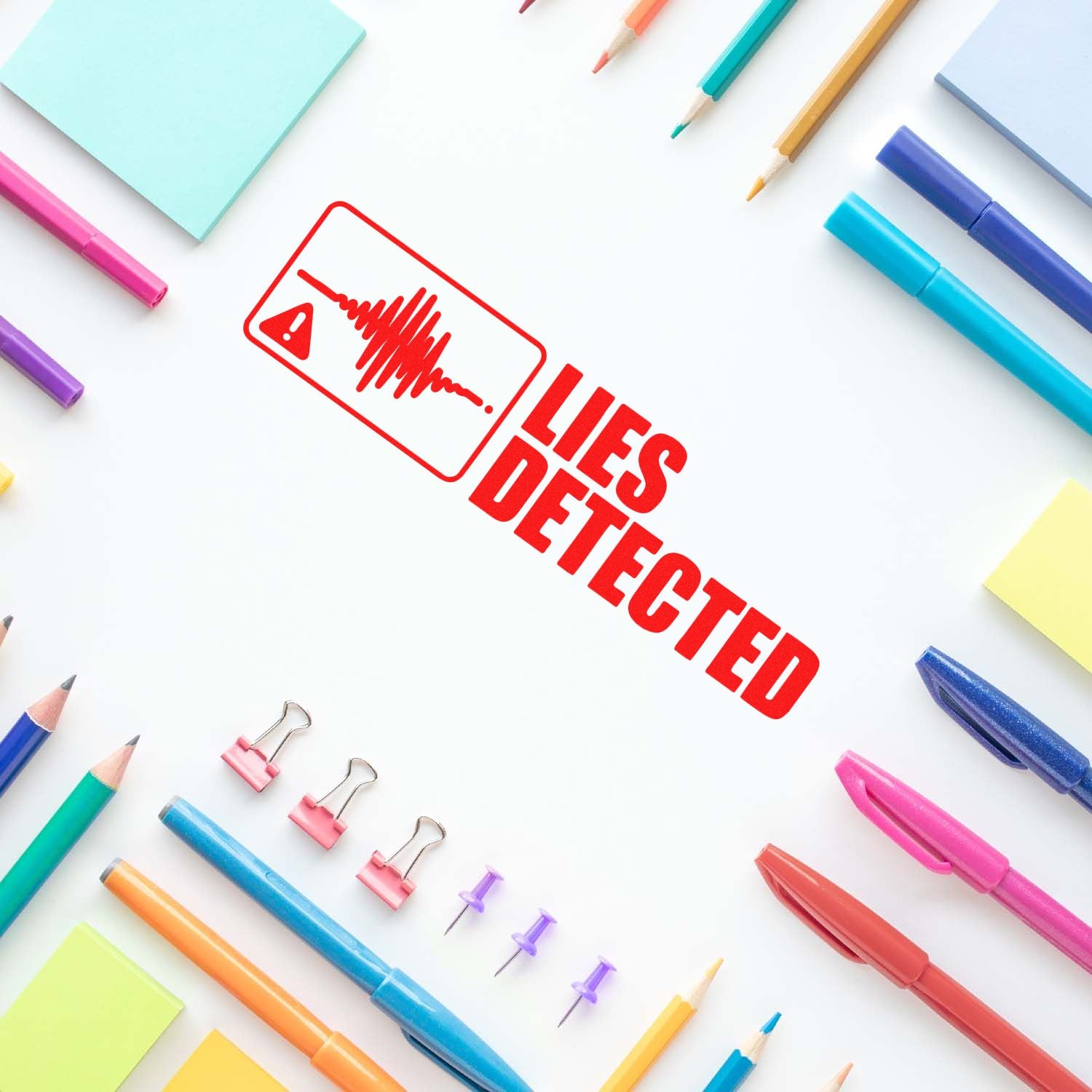 Red Lies Detected stamp with warning icon, surrounded by colorful pens, pencils, sticky notes, and seal clips.