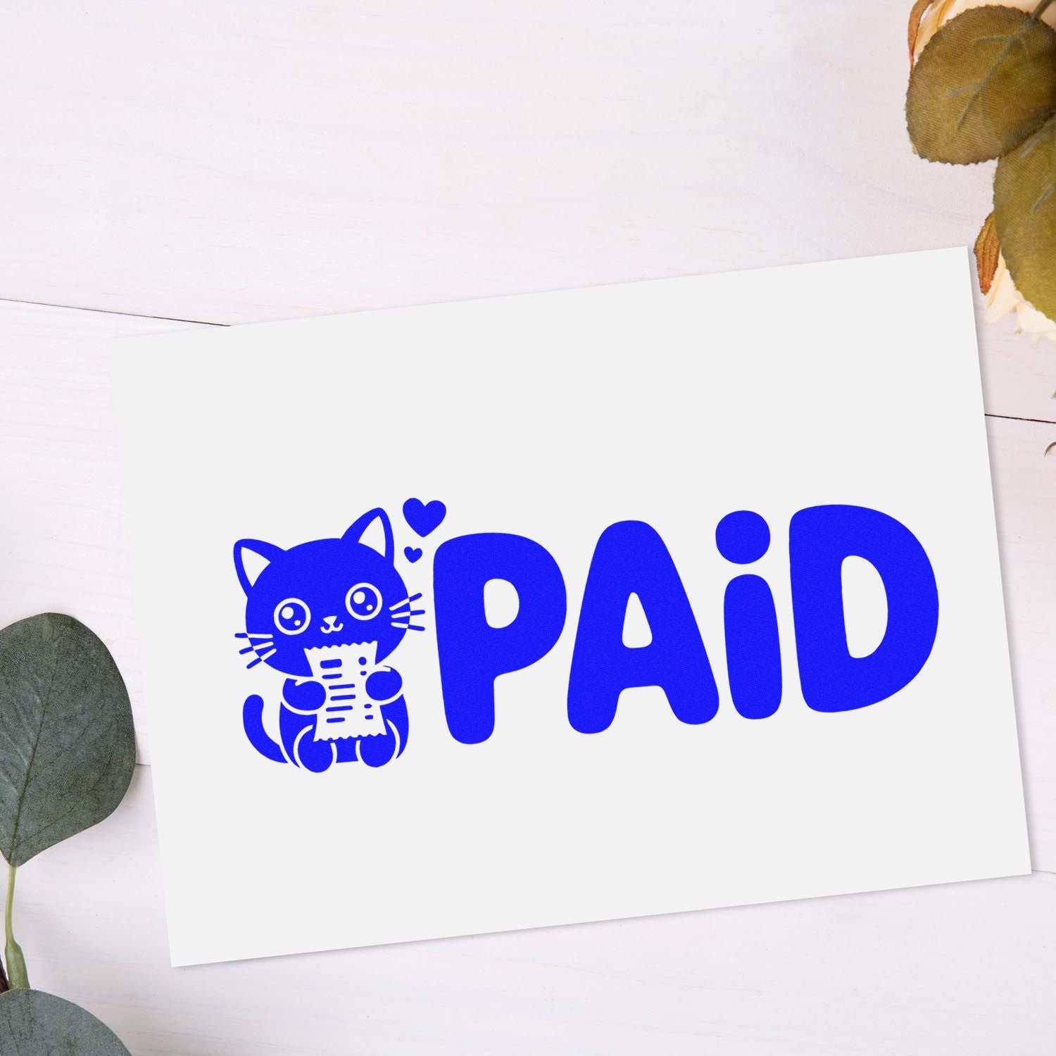 Blue PAID stamp and seal with a cute cat holding a receipt on a white card, accented with small hearts.