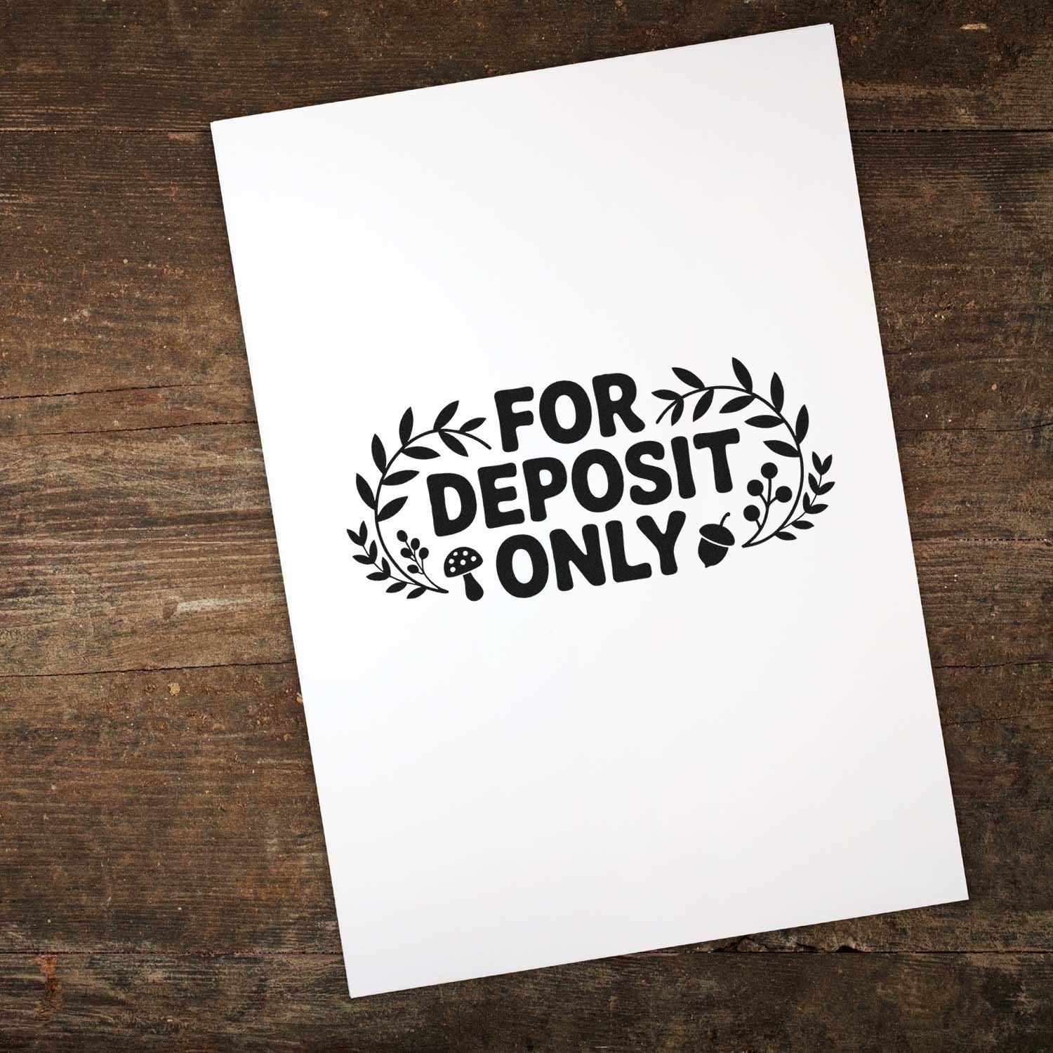 Black For Deposit Only bank stamp seal with leafy wreath on white paper over rustic wood background.