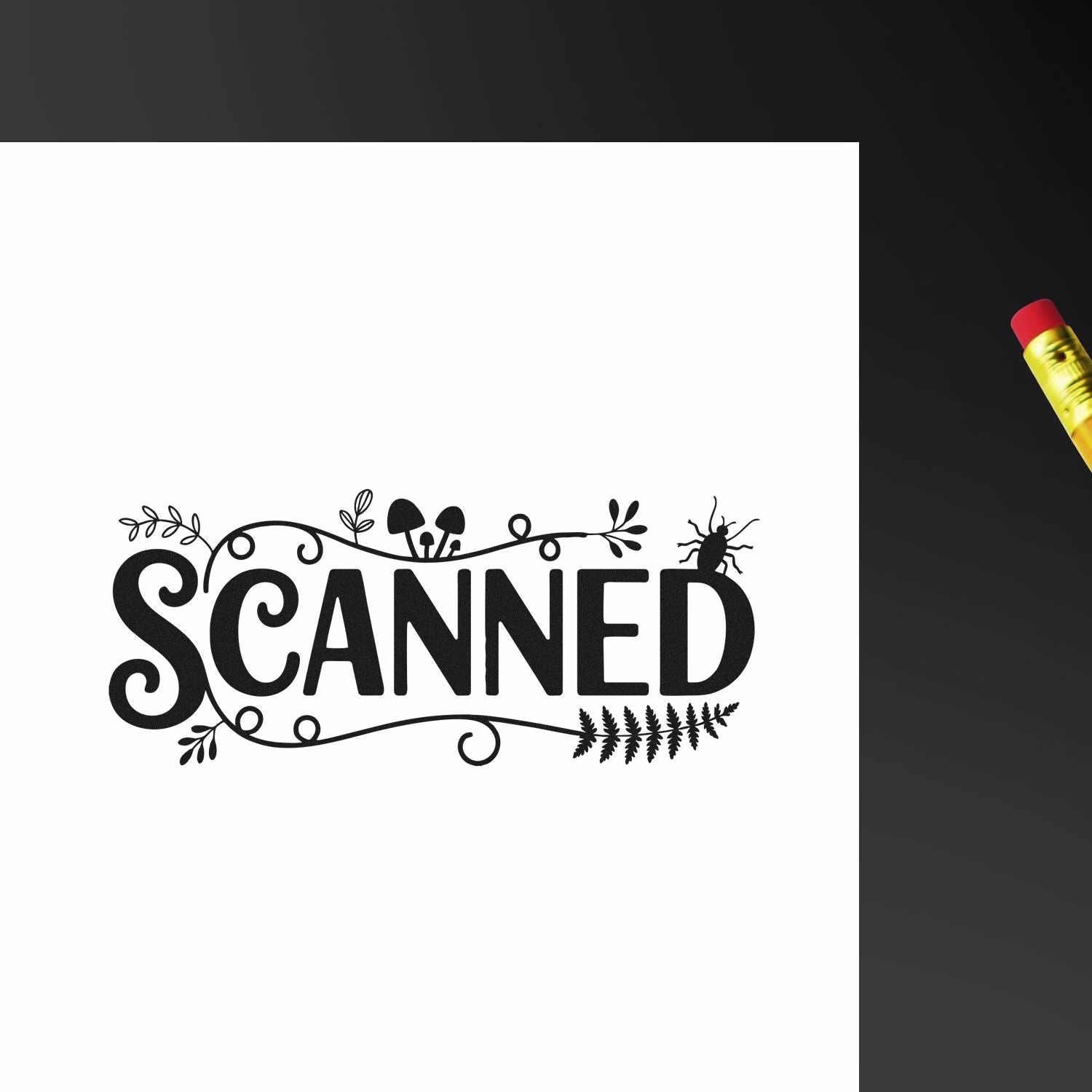 Black decorative SCANNED rubber stamp with floral accents on white paper, beside a yellow pencil with red eraser.