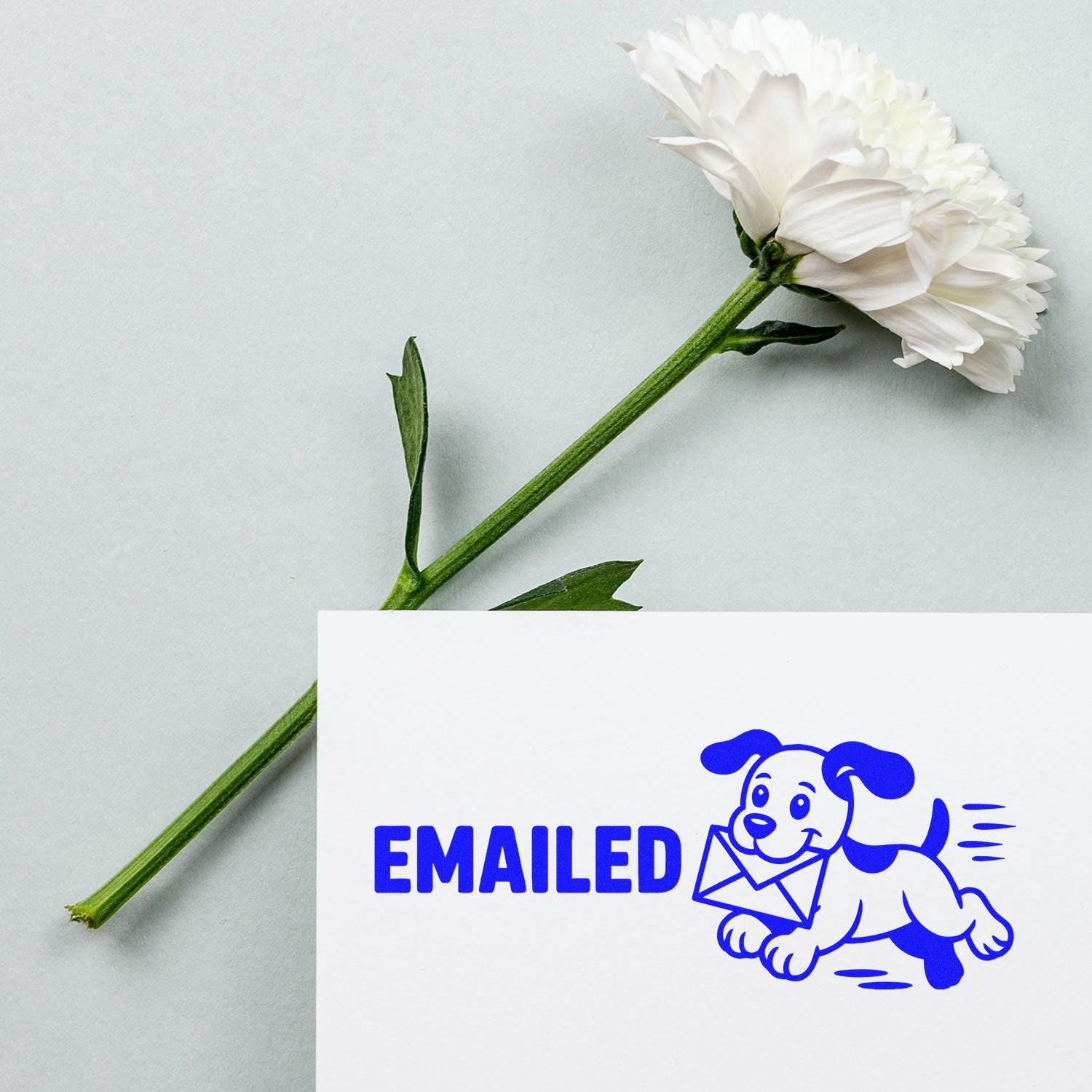 White flower beside a blue EMAILED rubber stamp seal with a running dog carrying an envelope on white card.