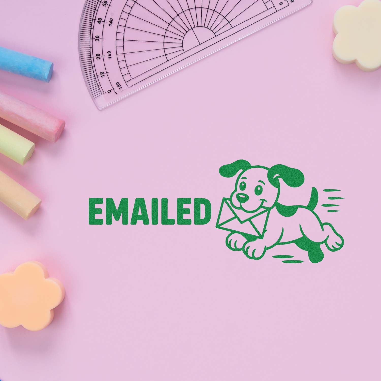 Green EMAILED stamp with dog and envelope on pink, framed by clear protractor and pastel stamp and seal products.
