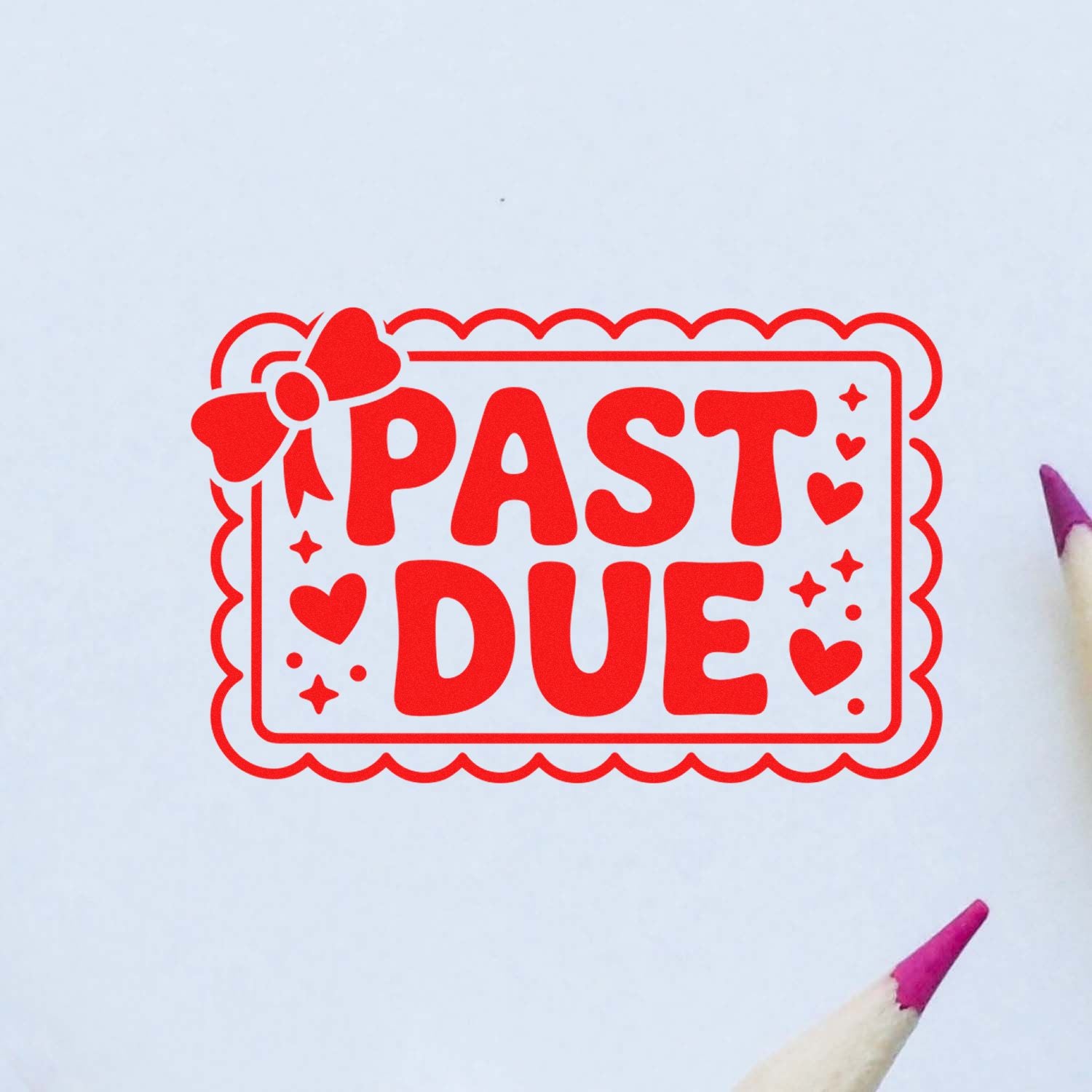 Red PAST DUE stamp seal with hearts and scalloped border on white paper, accented by a pink pencil tip.