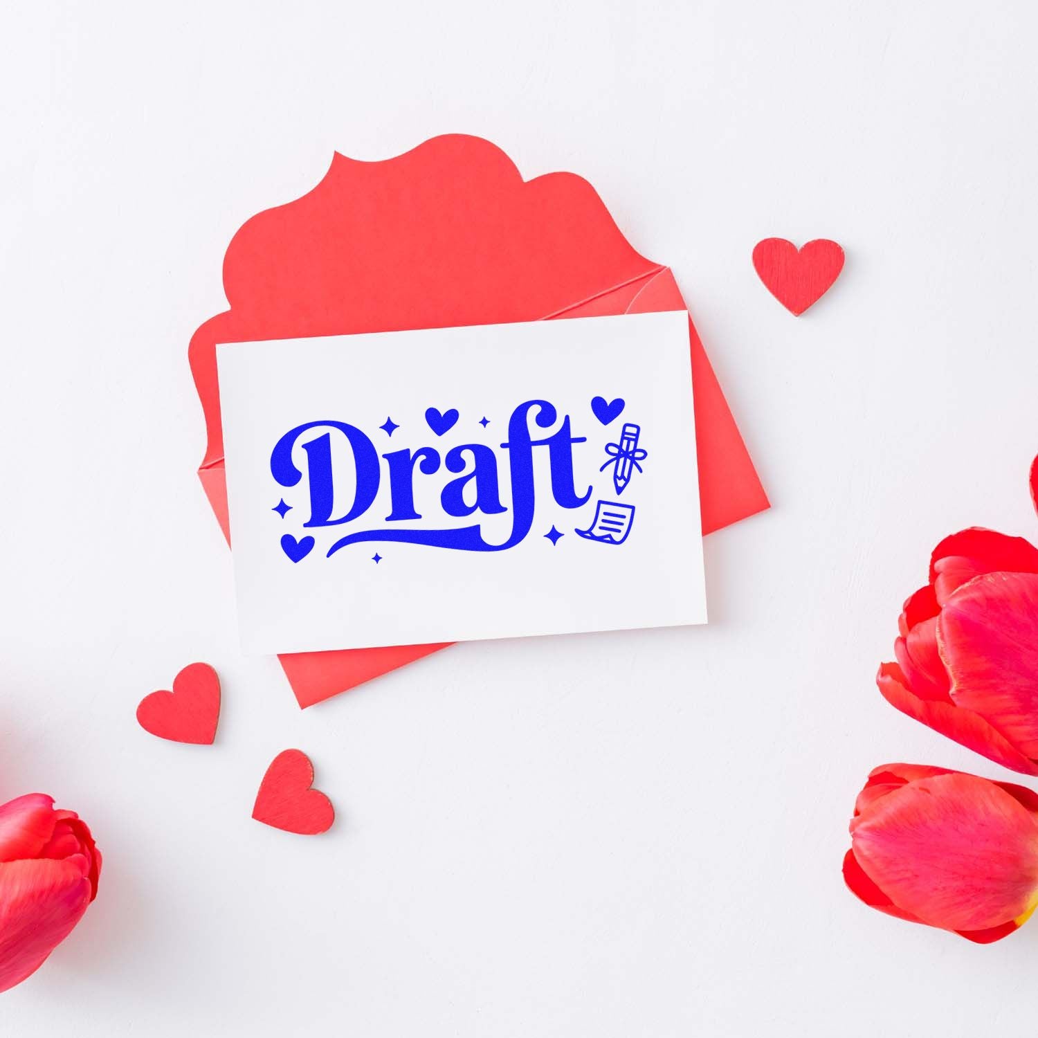 Blue Draft stamp on white card over a red envelope, with red heart seals and rose petals.