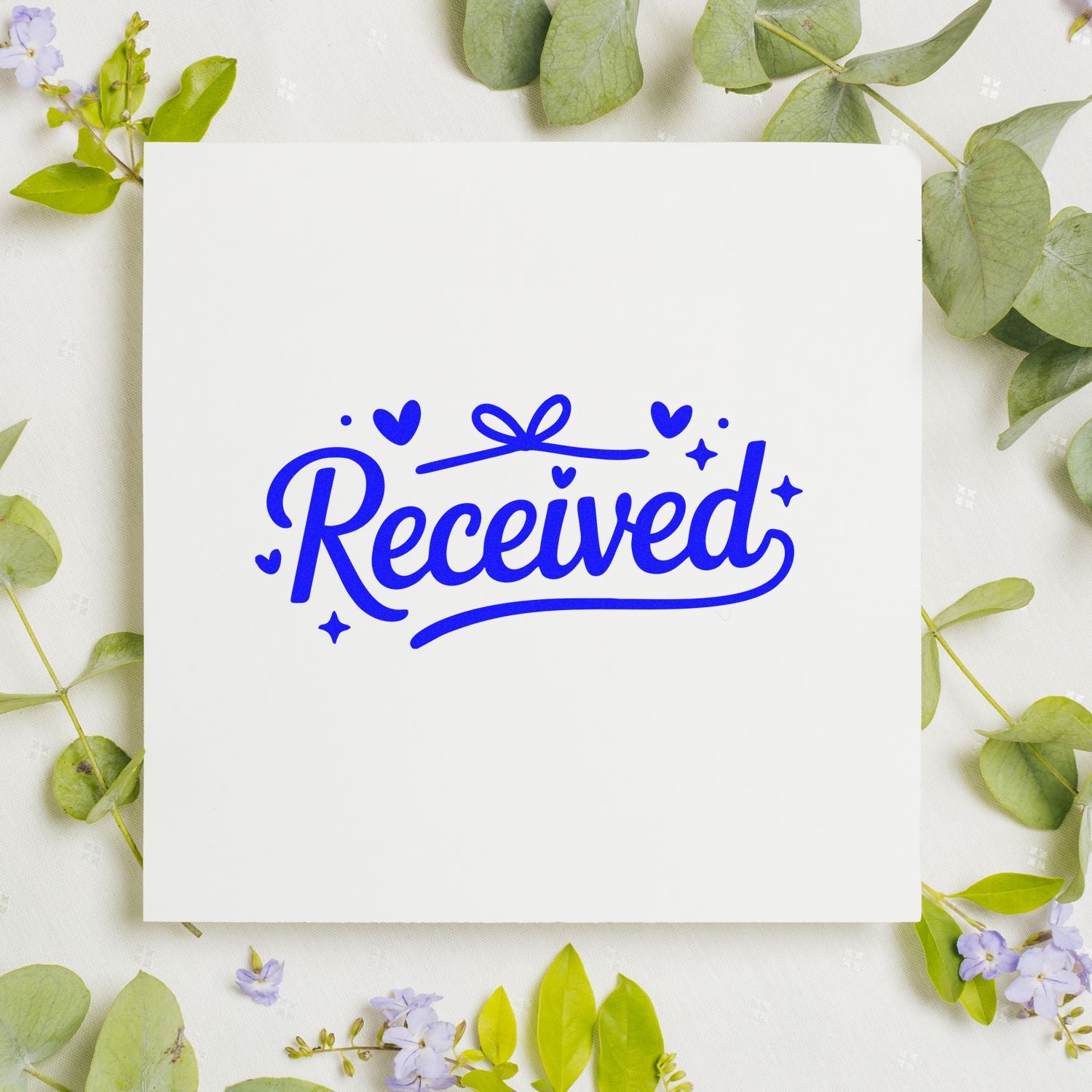 White stamp and seal card with bold blue Received script, hearts, and sparkles, framed by green leaves and purple flowers.