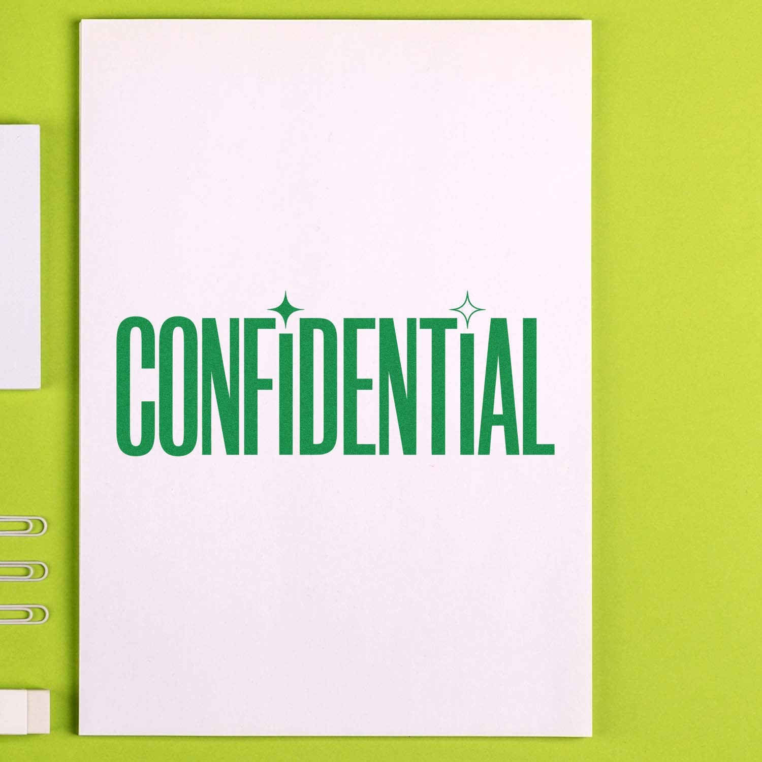 Green CONFIDENTIAL stamp seal on white paper with sparkles, set against a lime background.