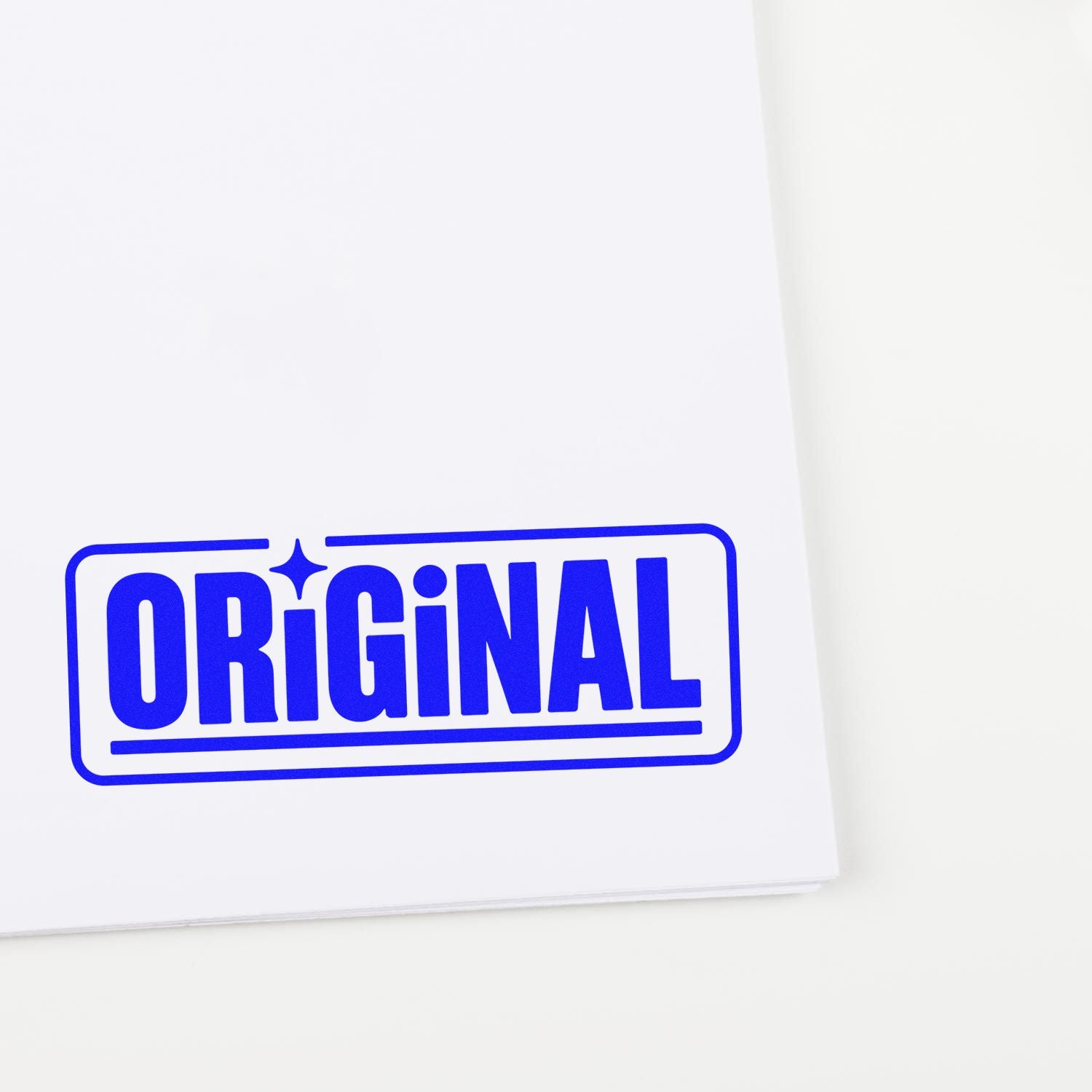Blue ORIGINAL stamp seal on white paper, bold block letters with a rounded rectangular border.