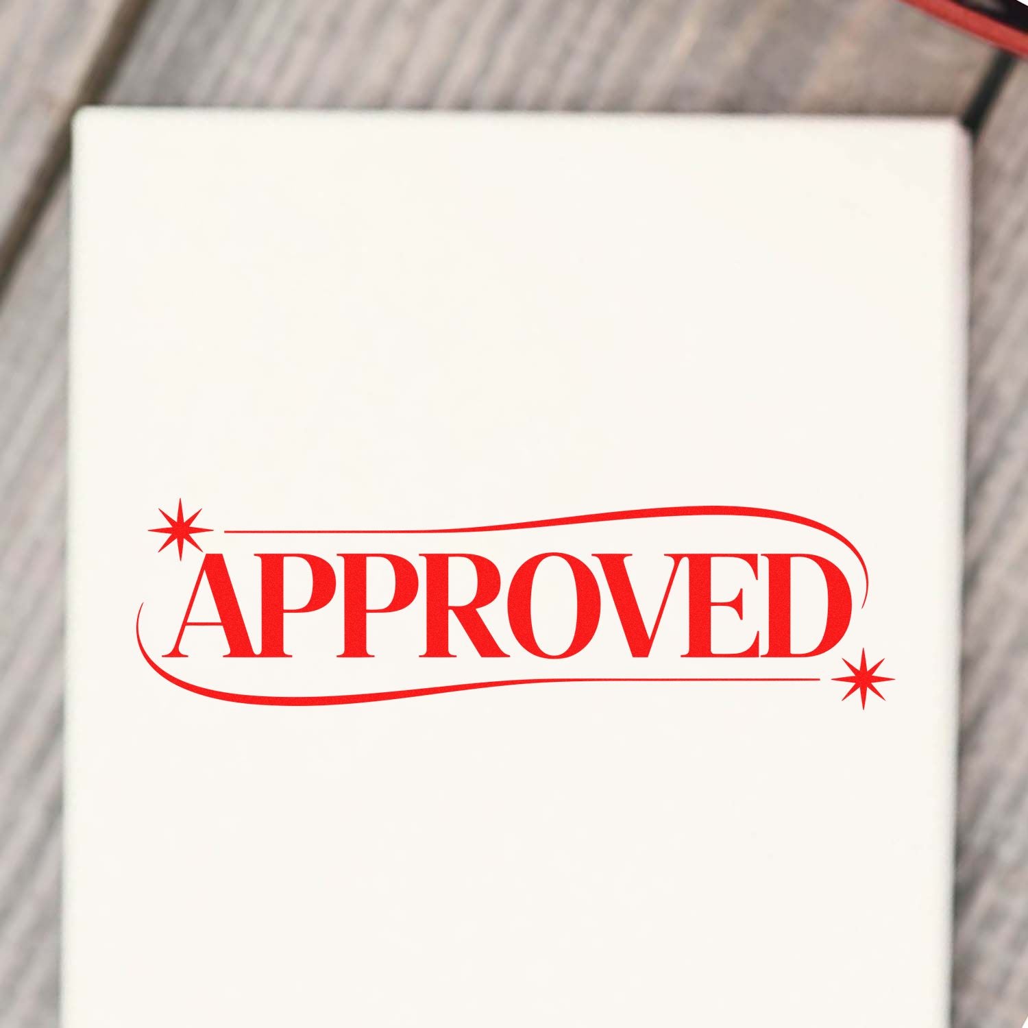 Red APPROVED rubber stamp seal on white background, with decorative stars and rounded border.