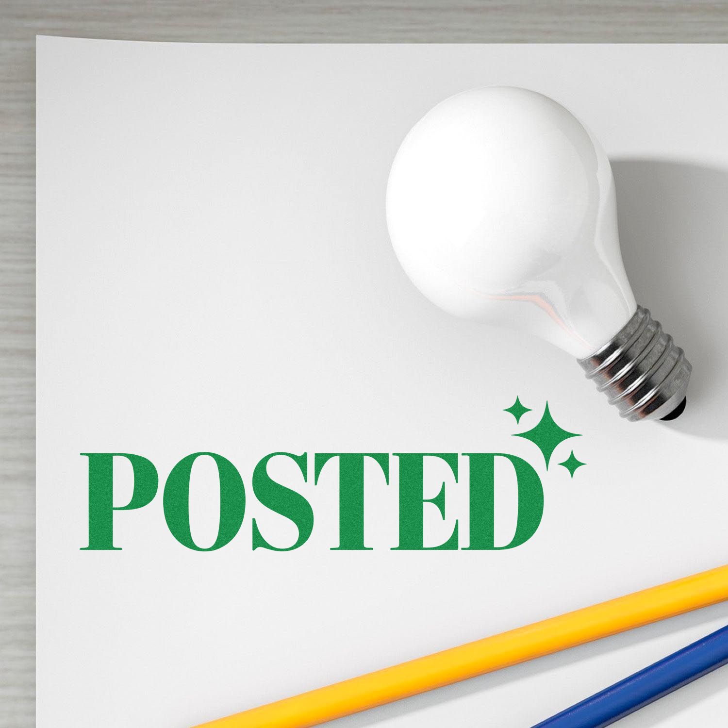 Green POSTED stamp seal product with white light bulb, sparkles, and yellow-blue pencils