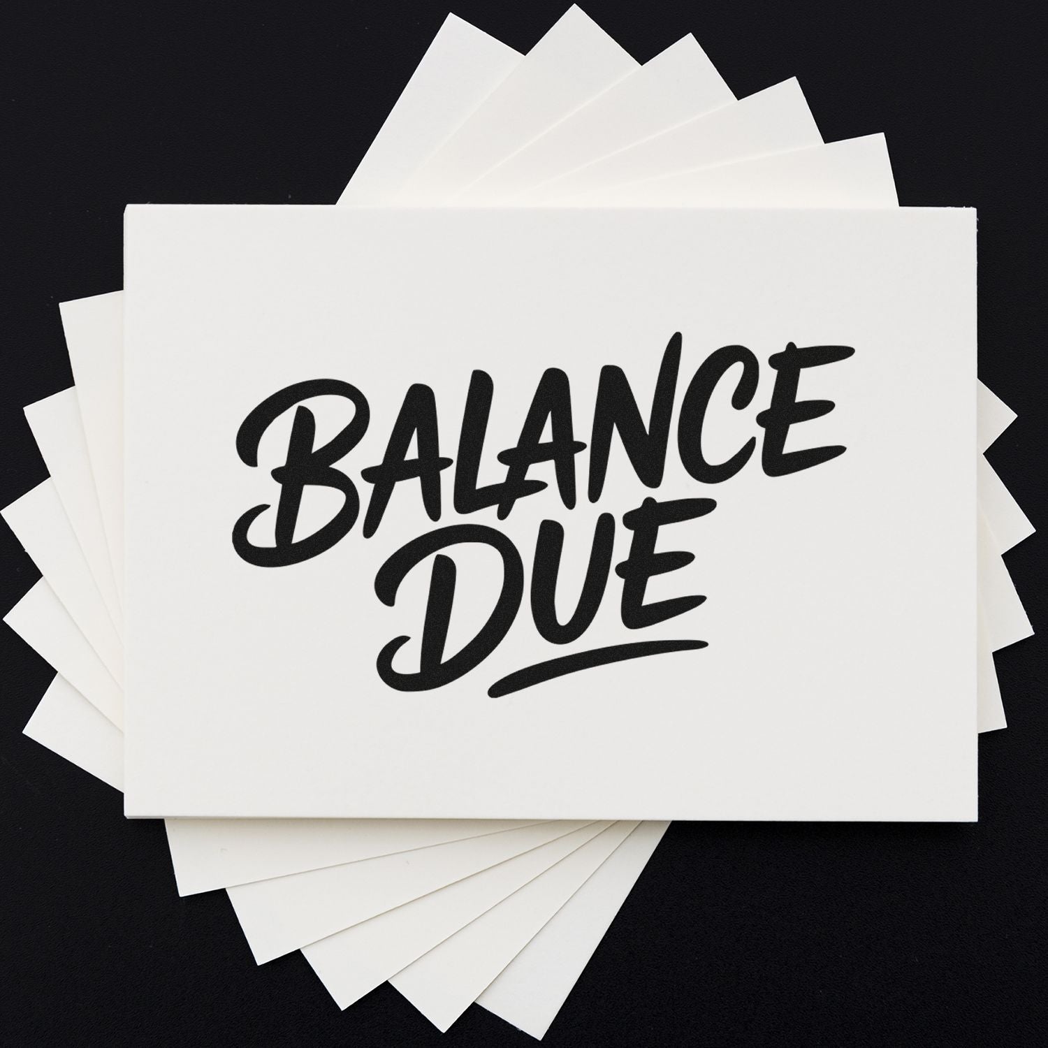 White stamp and seal product cards with bold black BALANCE DUE text on layered white sheets against a black background.