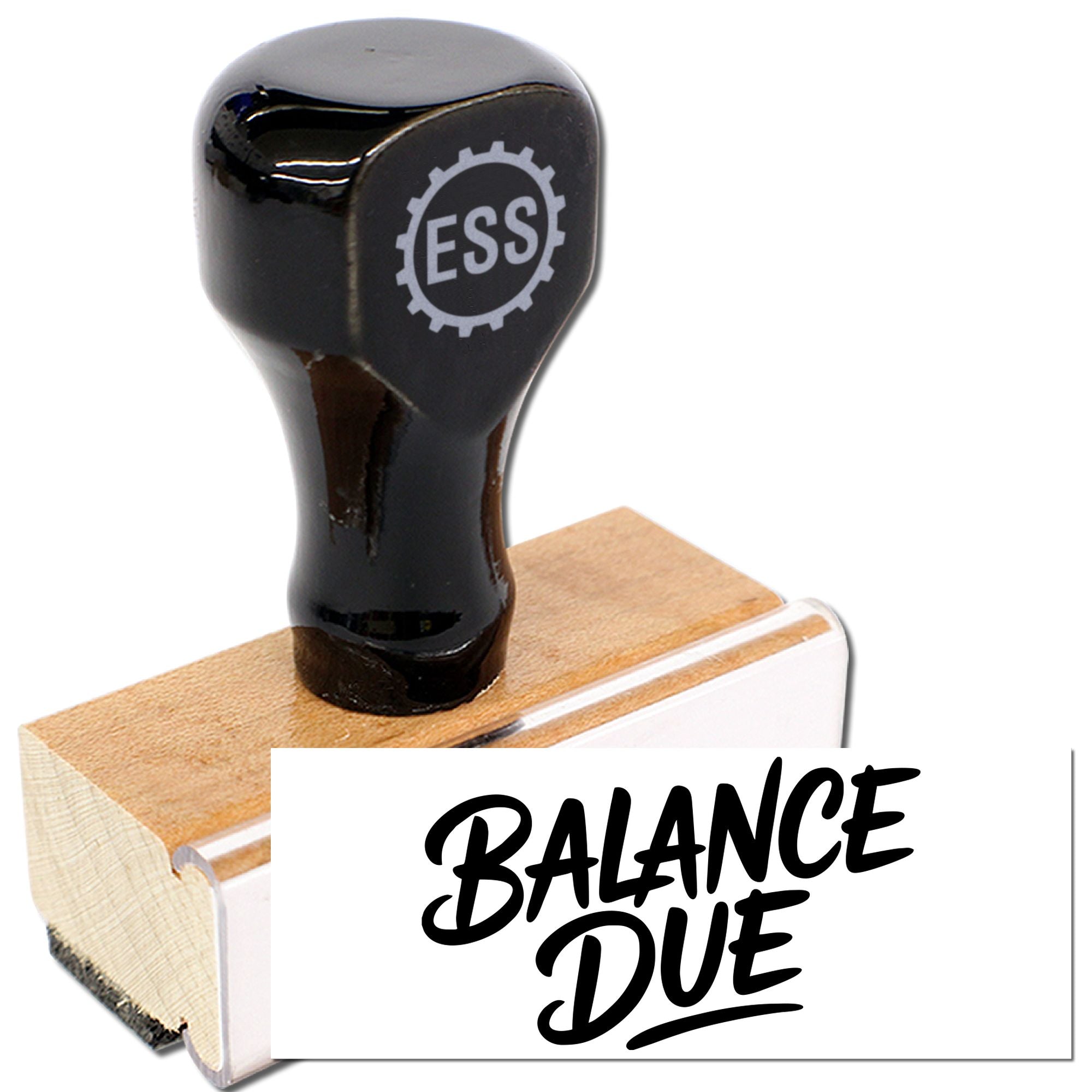 Black ESS stamp and seal with wooden handle, marking bold BALANCE DUE on a white card