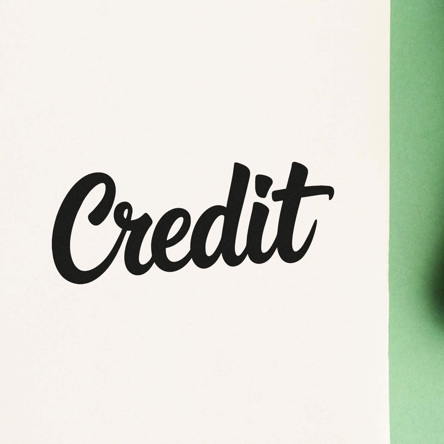 Black Credit stamp on white paper with green border, showcasing custom seal product.