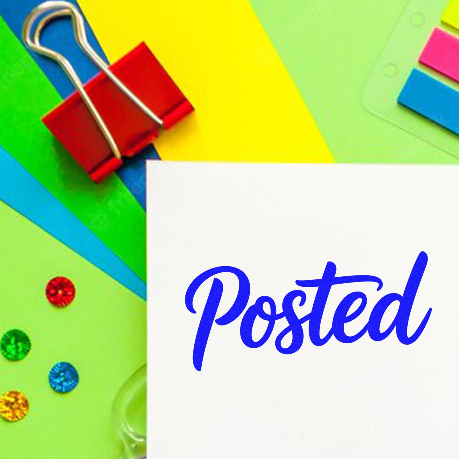 Blue Posted stamp on white paper with colorful paper clips, sticky notes, and decorative seal stickers on green-yellow background