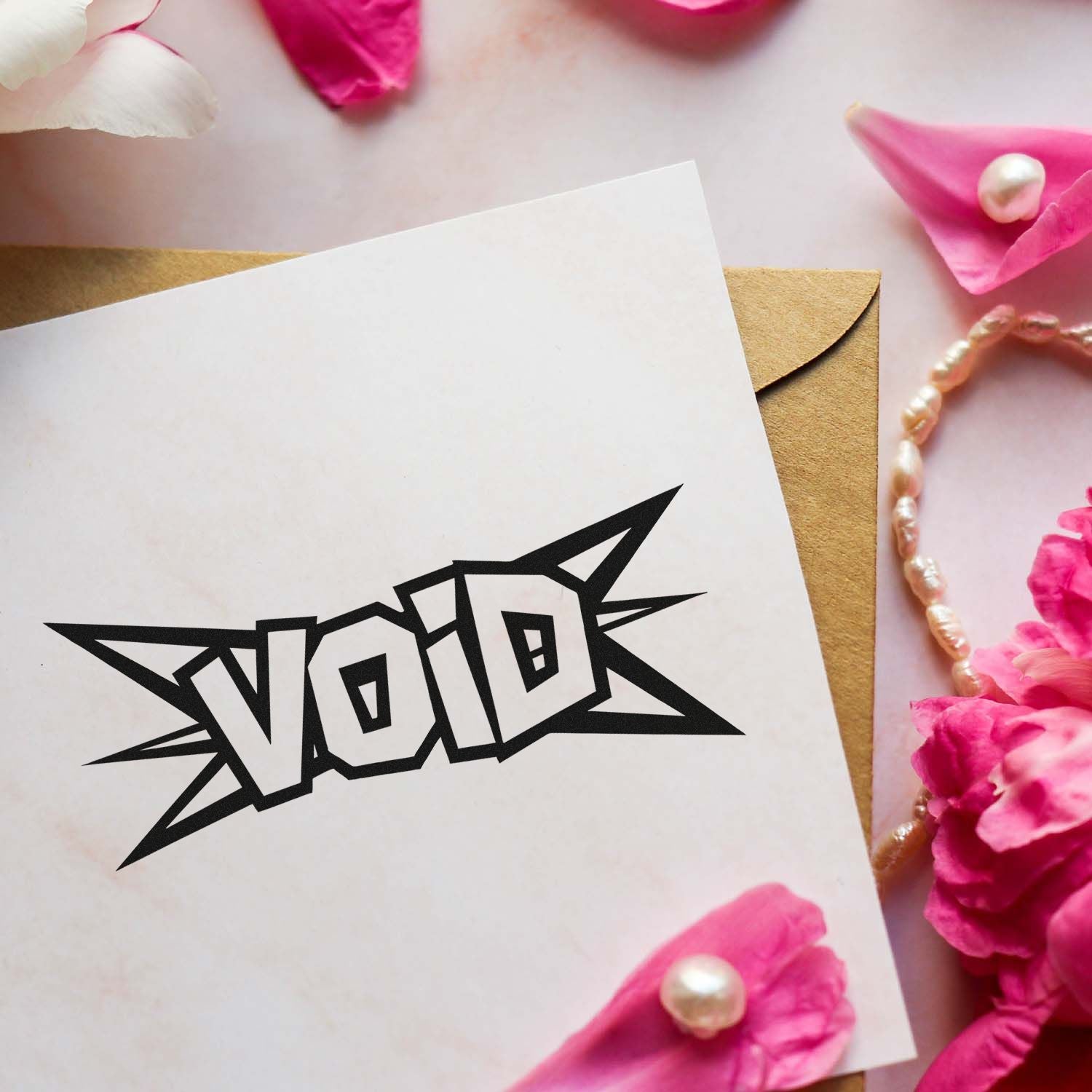 Custom stamp and seal sample with black VOTE imprint on white card, kraft envelope, pink petals, and pearls.