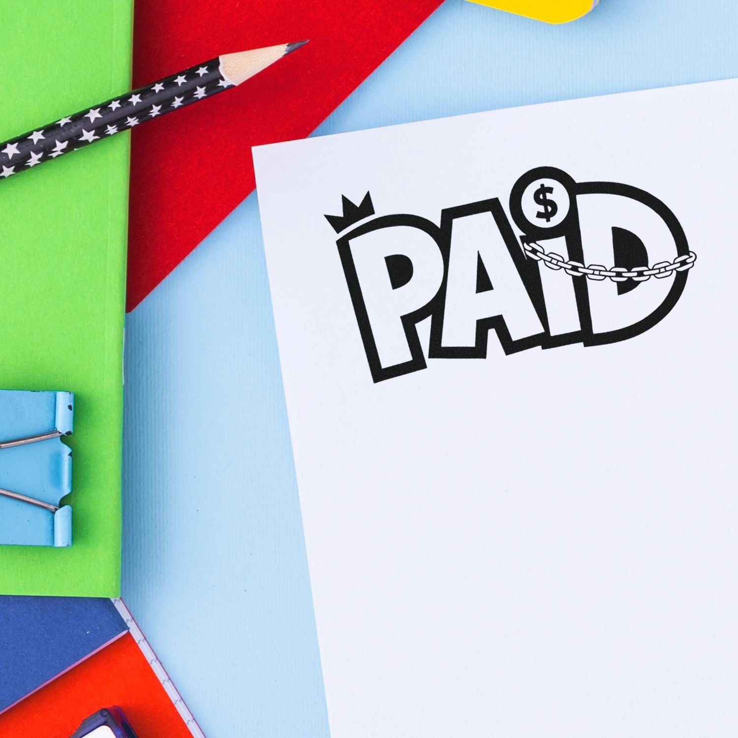 Colorful stamp and seal products: black pencil, white paper with bold PAID seal, and red, green, blue, yellow backgrounds.