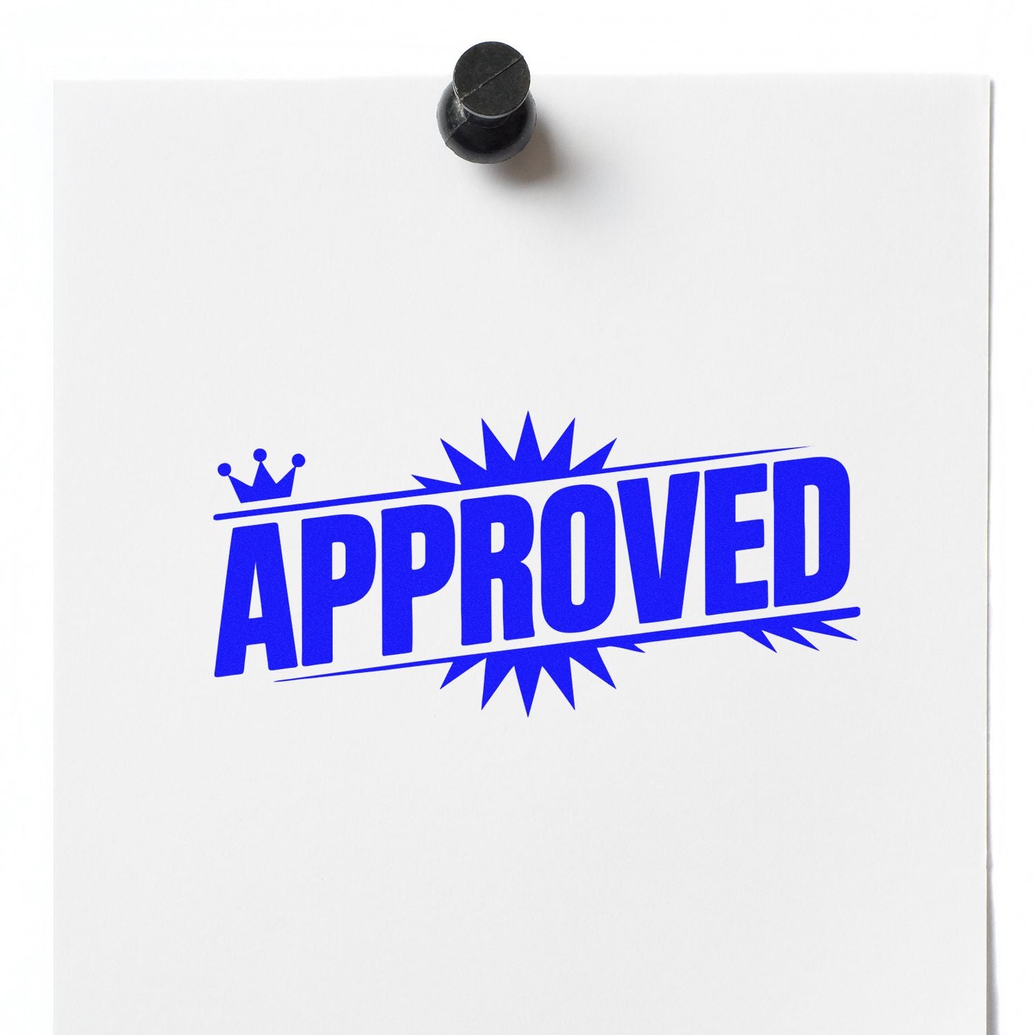 Blue APPROVED rubber stamp seal on white paper, pinned at top with a black tack.