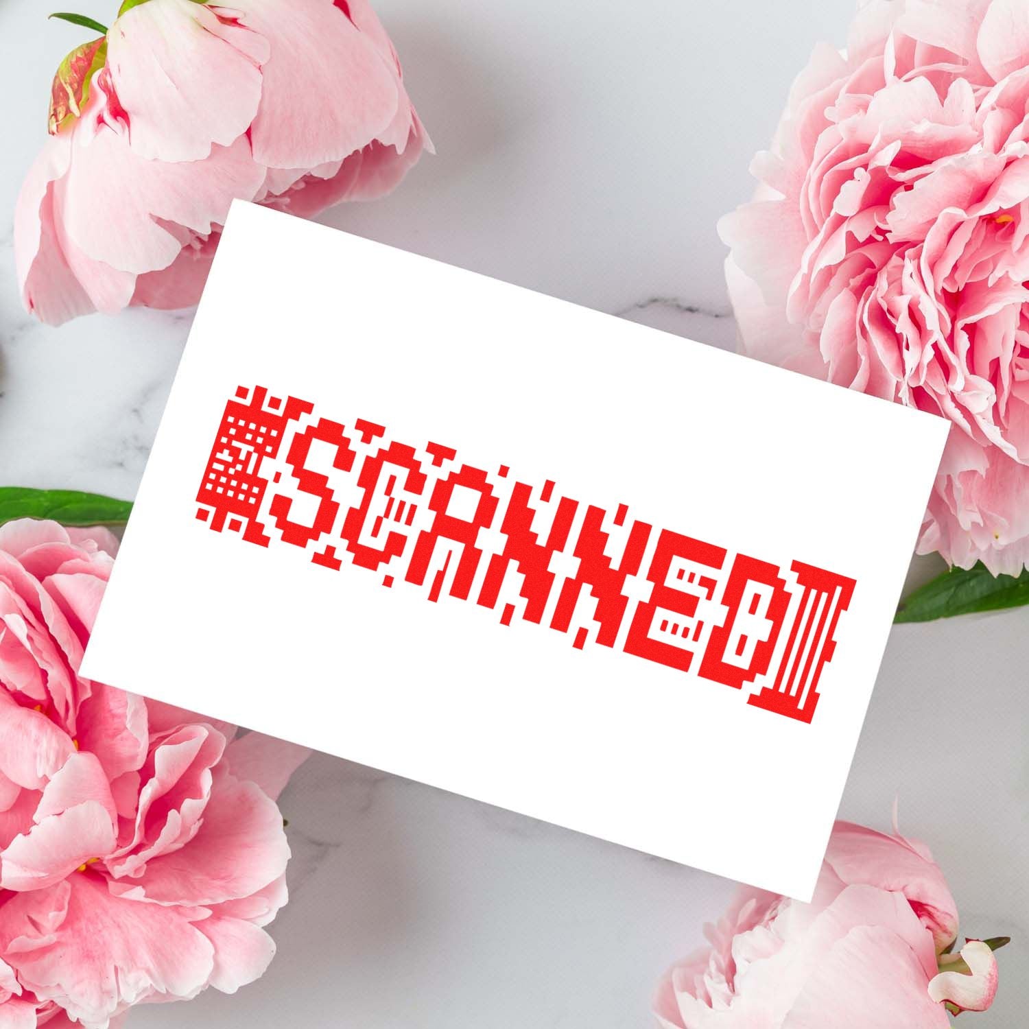 White card with bold red stamp-style seal, framed by soft pink peonies on a light marble background.