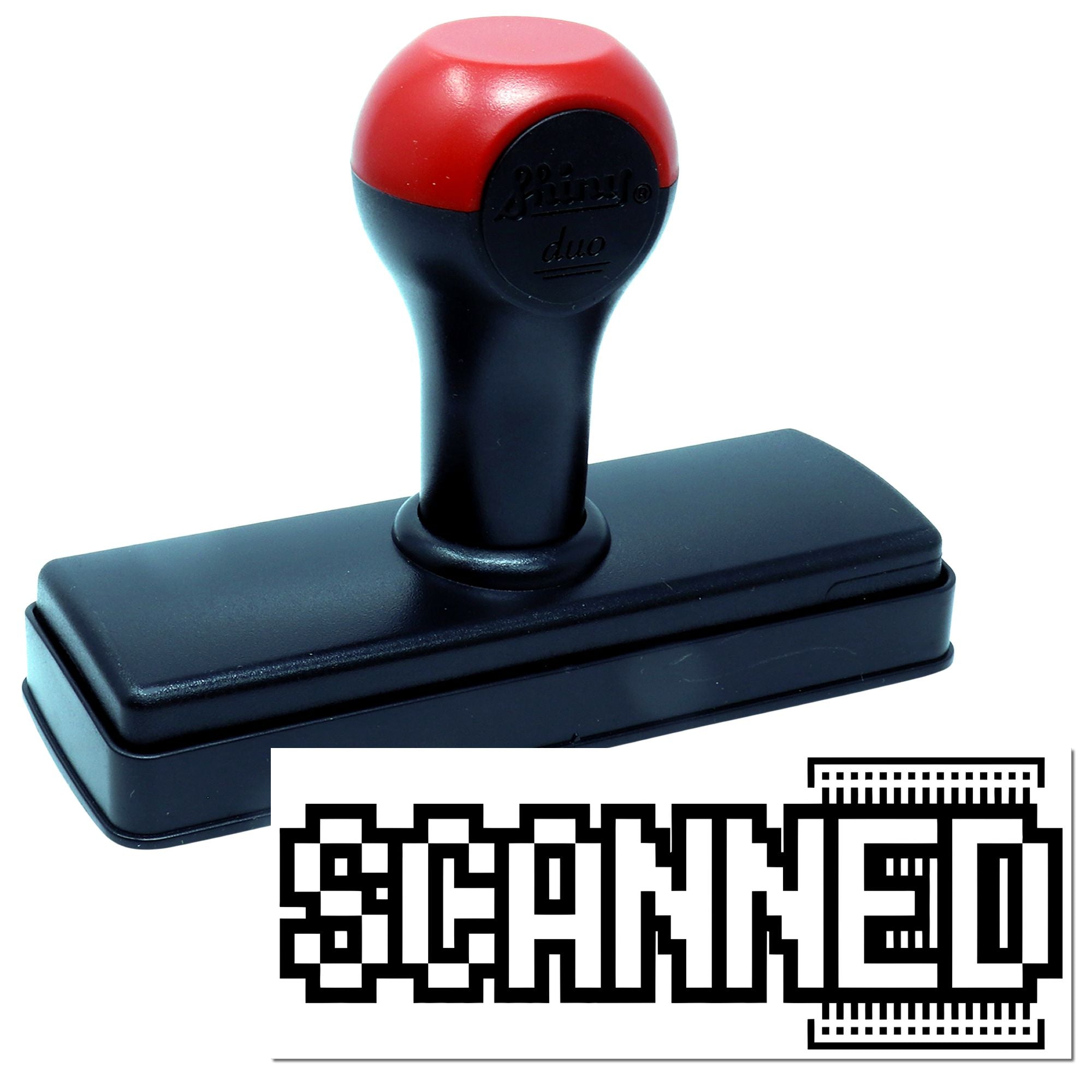 Black self-inking stamp and seal with red handle, showing a bold STAMPED impression.