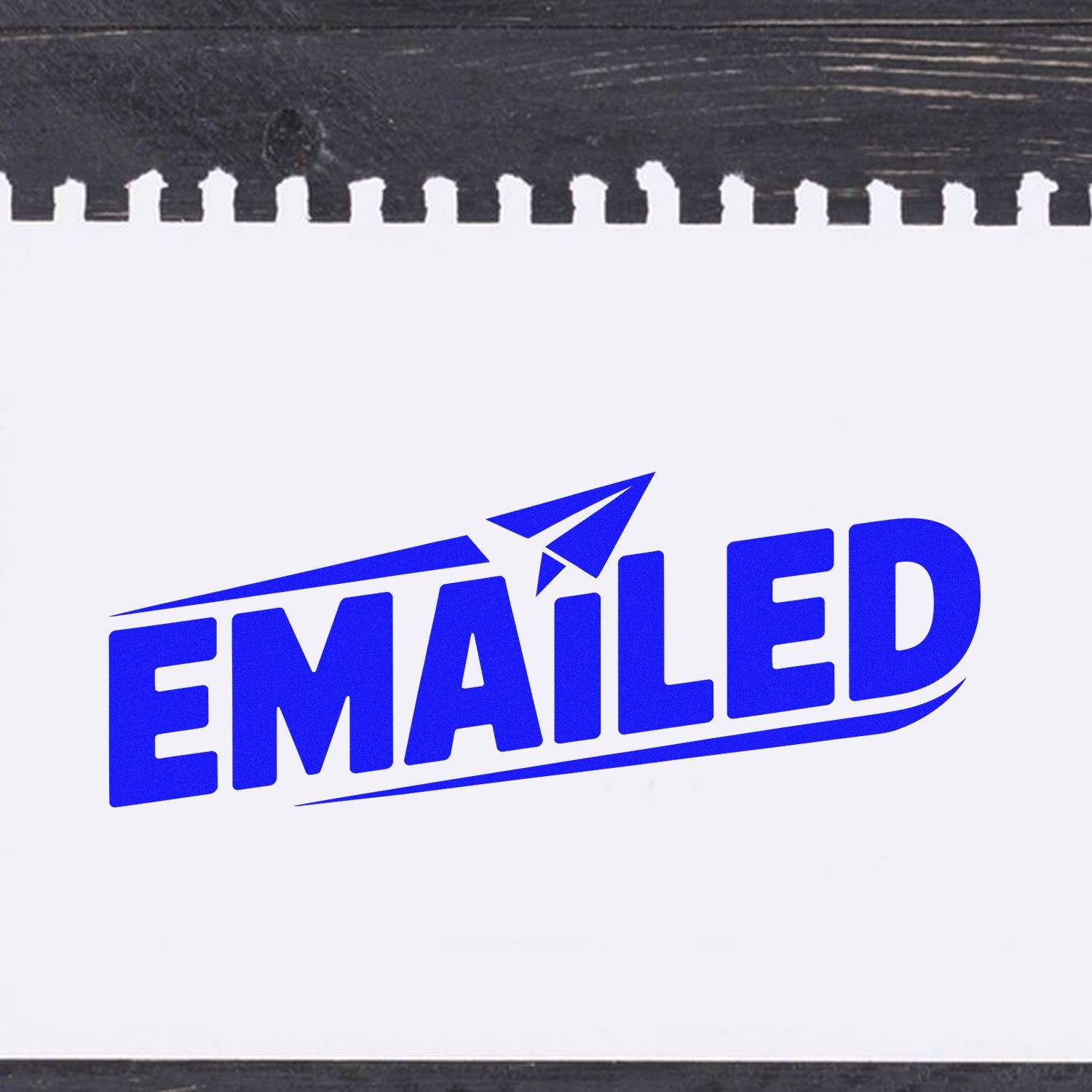 Blue EMAILED rubber stamp seal with paper plane icon on white paper, black spiral-bound edge
