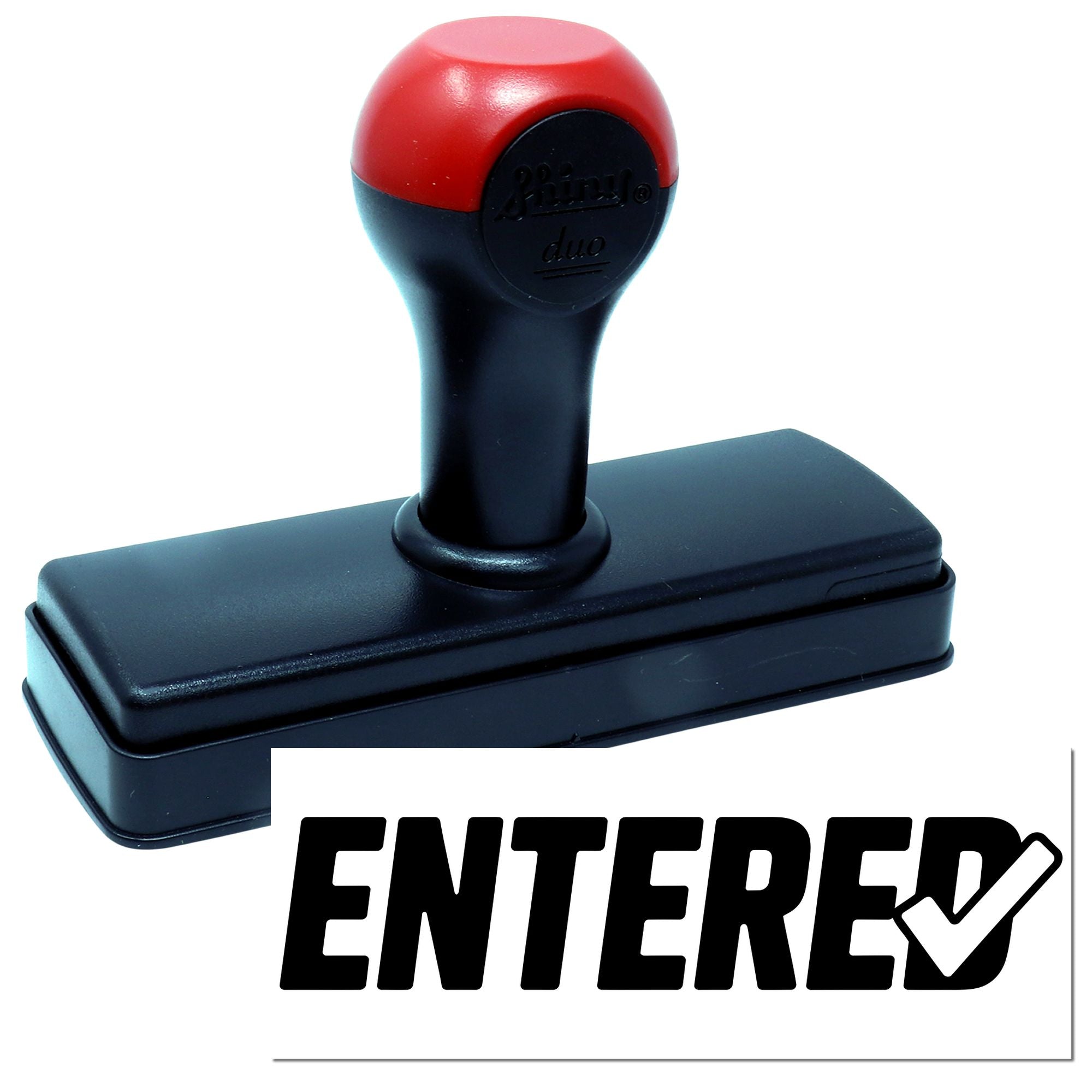Black and red self-inking Entered stamp and seal with rectangular base and round handle on white background.