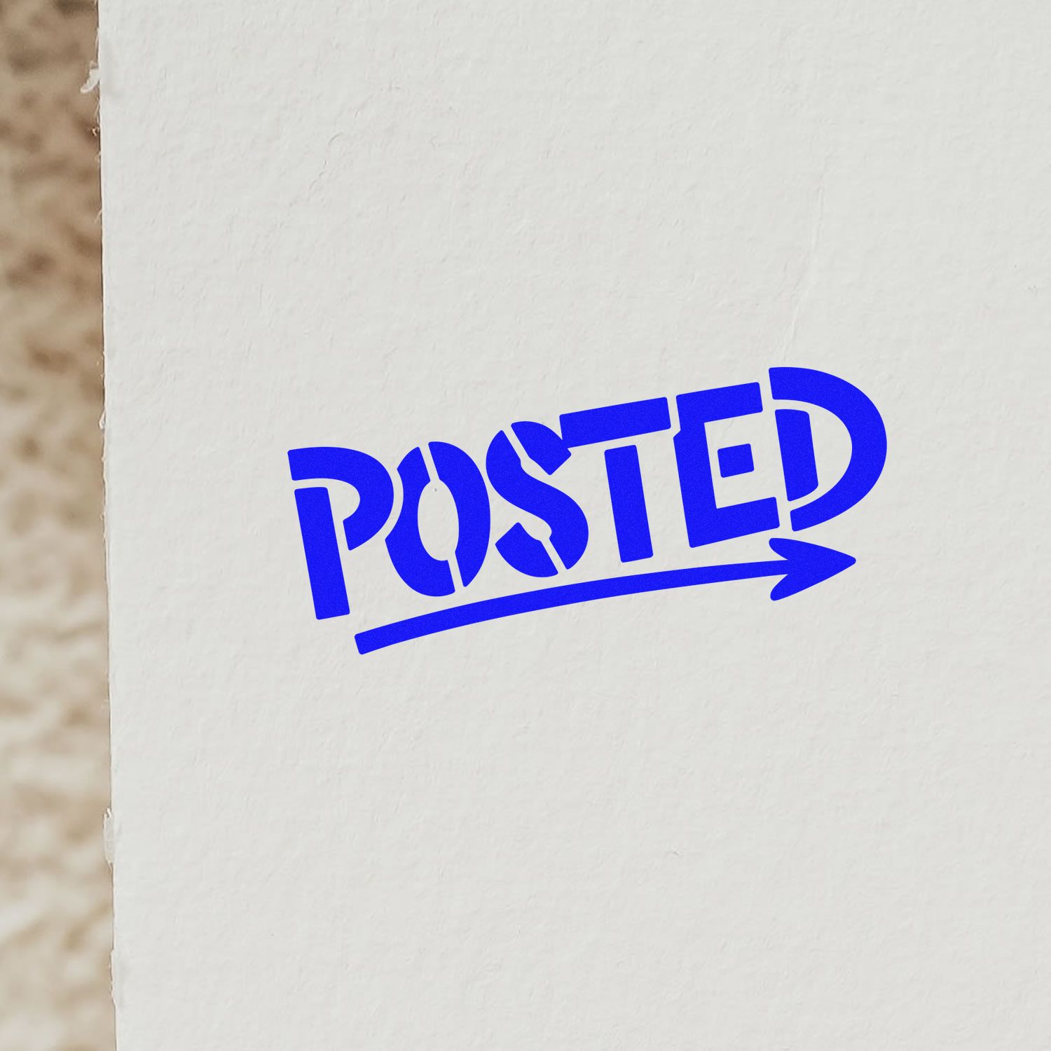 Blue POSTED stamp with arrow on white paper, showing a seal for stamp and seal products.