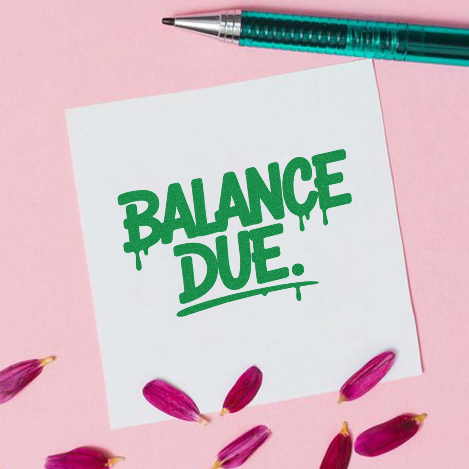 Green Balance Due stamp and seal on white paper, teal pen, pink background, and magenta petals.