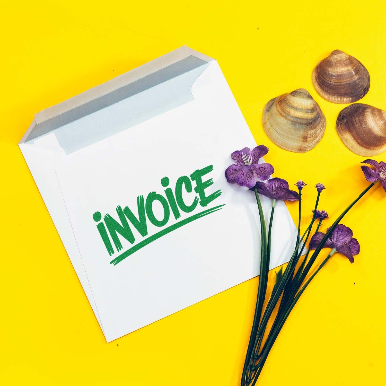 White invoice envelope with green stamp text, purple flowers, and seashell seal samples on bright yellow background.