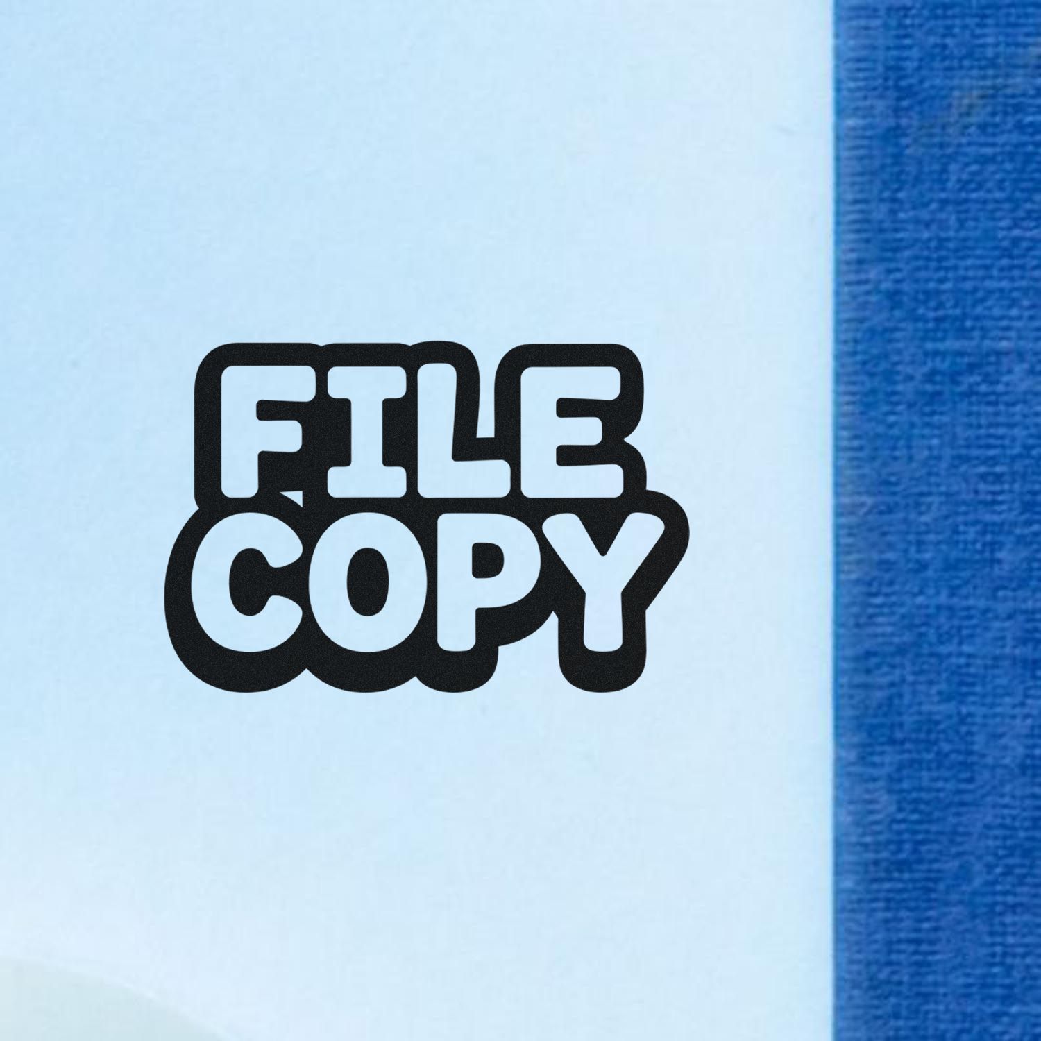 Black FILE COPY seal stamp on light blue paper with a blue edge