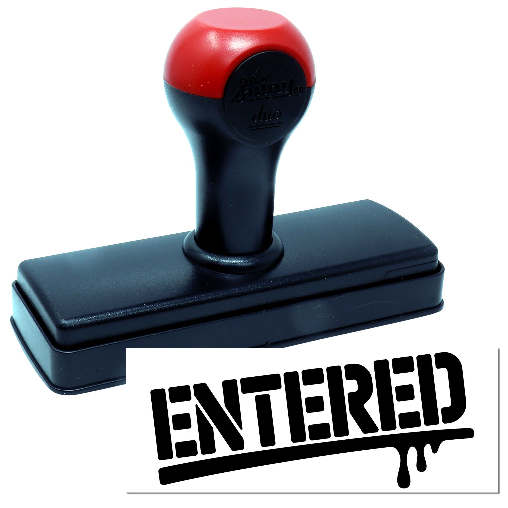 Red and black self-inking rubber stamp with ENTERED seal impression