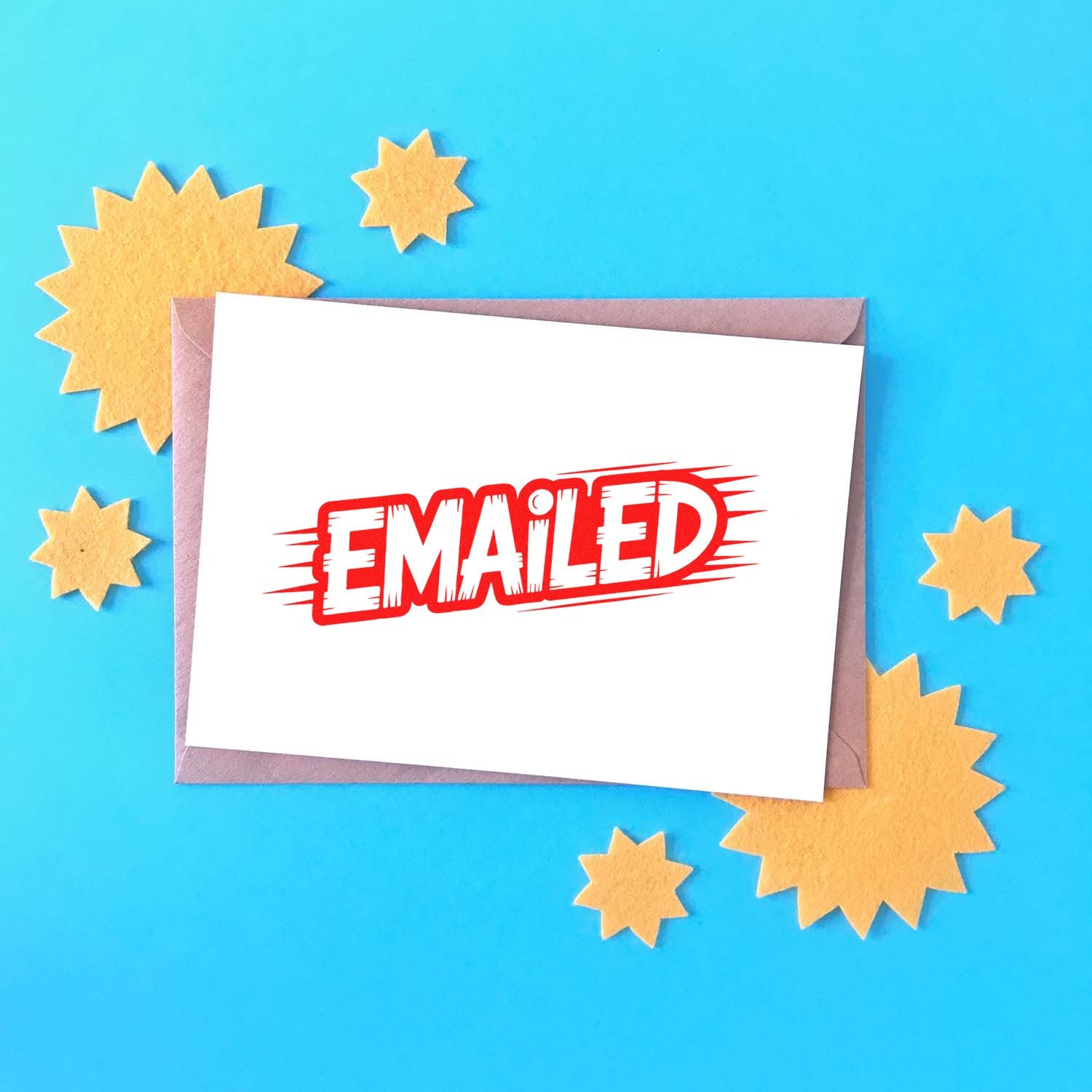 Red EMAILED stamp on white card over mauve envelope, with yellow starburst seals on a blue background.