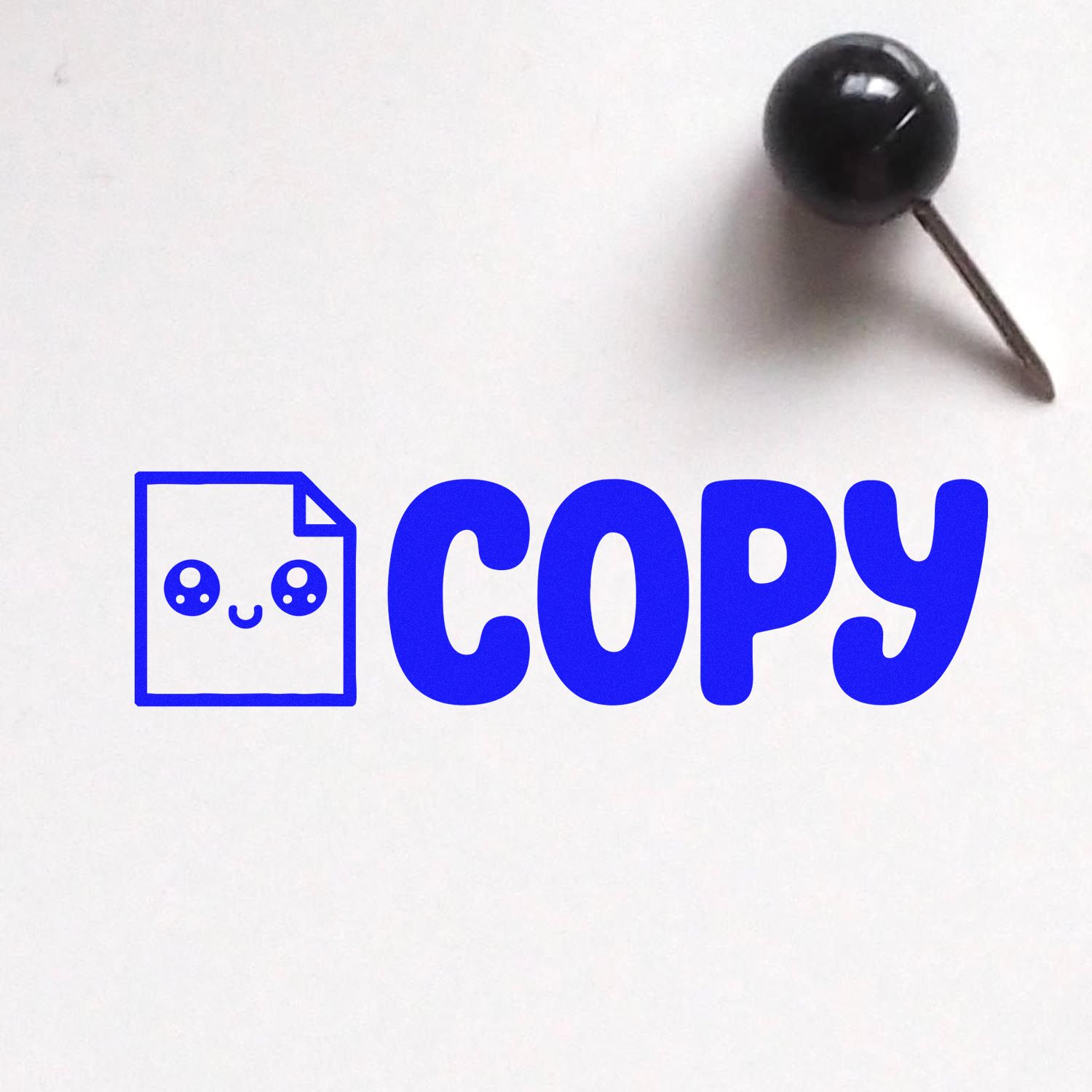 Blue COPY seal stamp with document icon and black pushpin on white background