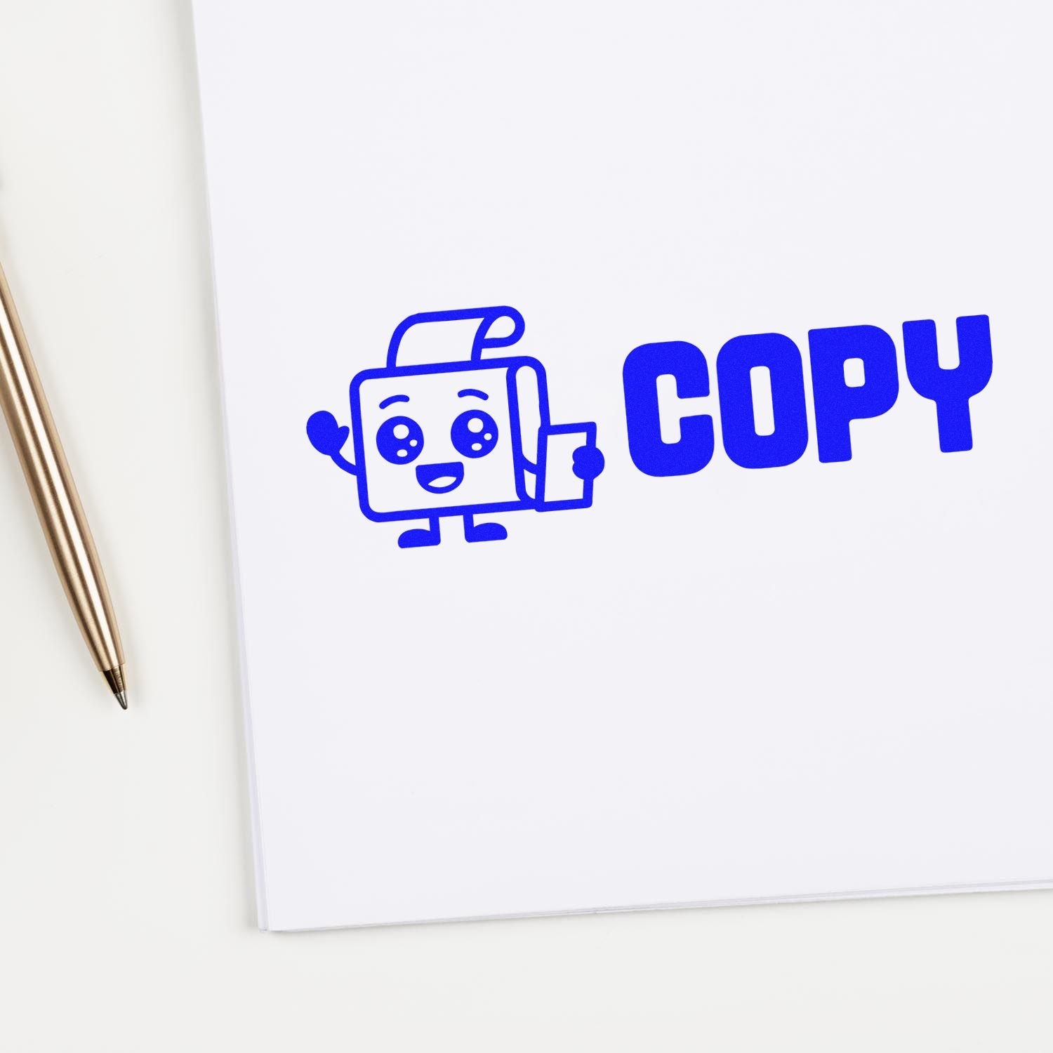 Blue COPY stamp and seal logo with mascot on white notebook beside a gold pen