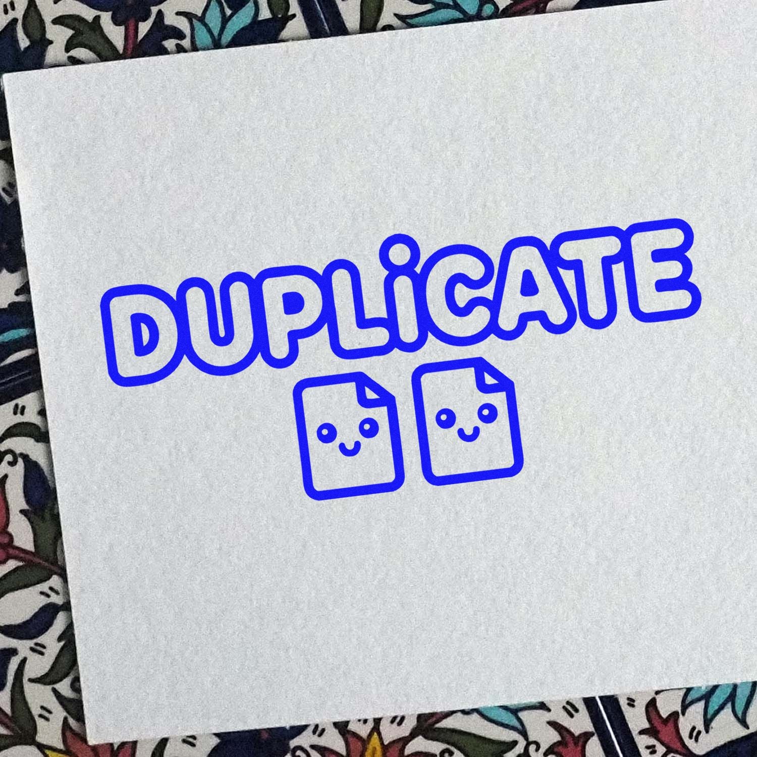 Blue duplicate stamp and seal design with two smiling document icons on white paper.