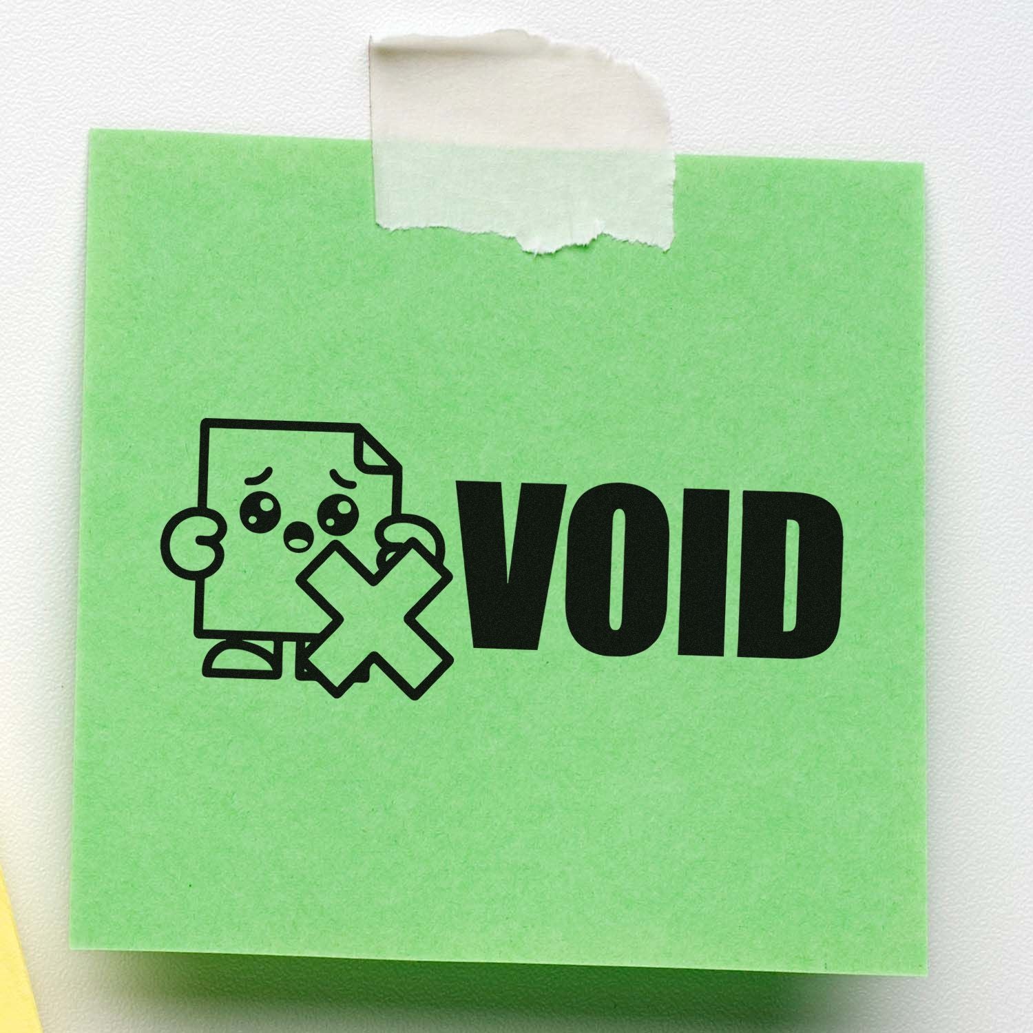 Green VOID tamper-evident stamp seal with sad paper icon, on taped backing
