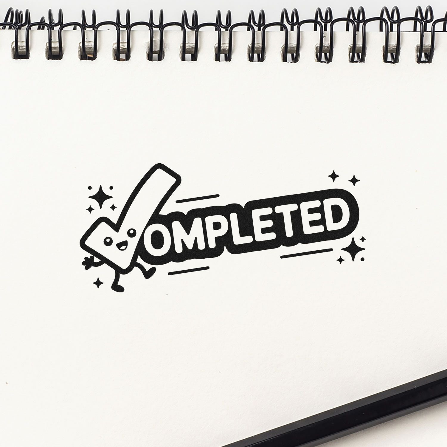 Black COMPLETED stamp seal with a smiling checkmark and sparkles on a white spiral notebook page.