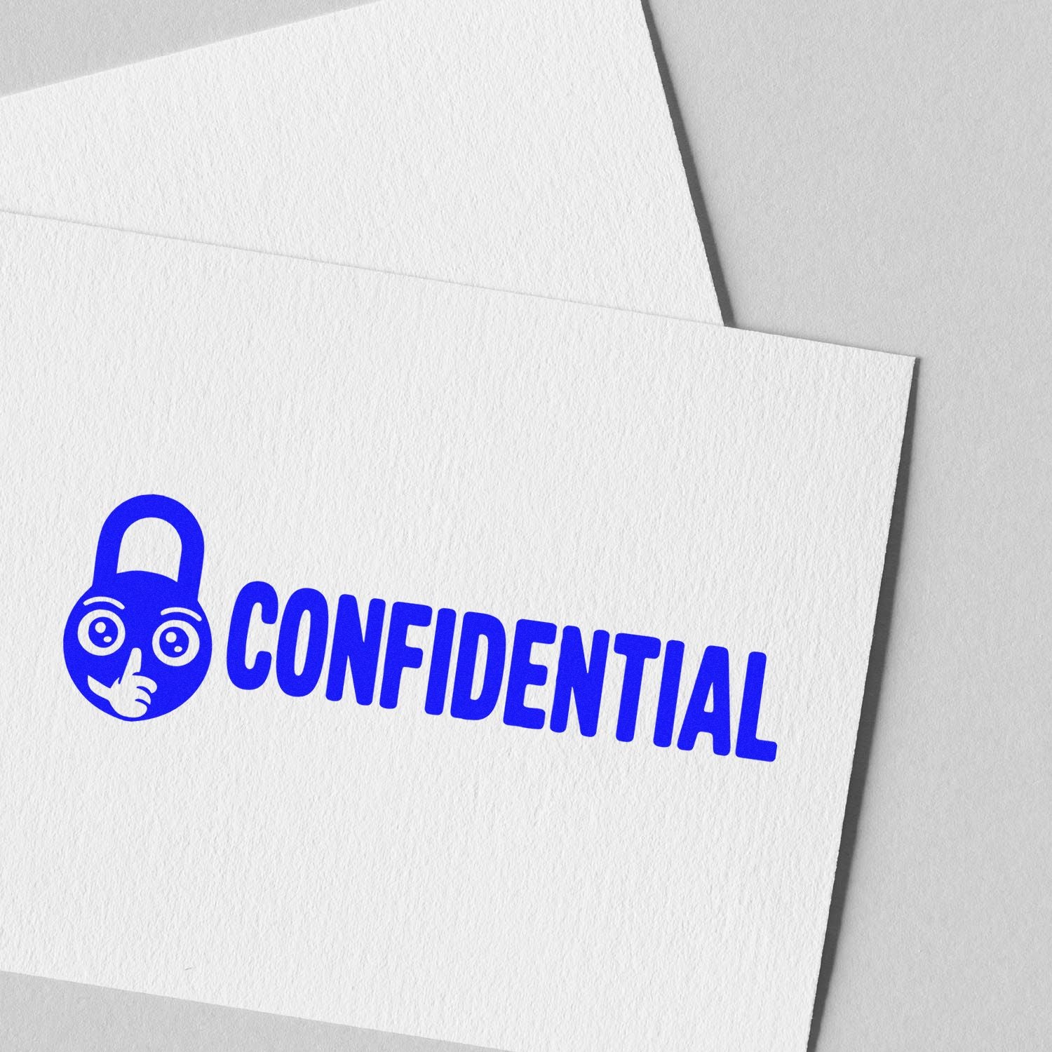 Blue confidential stamp with lock icon on white textured paper and envelope, a security seal for documents.