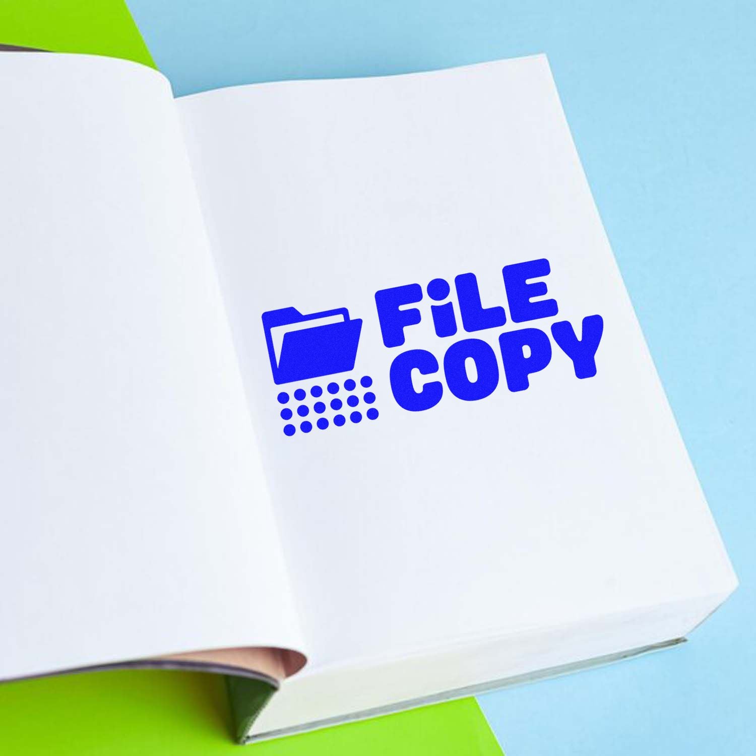 Blue FILE COPY stamp with folder icon on a white booklet, shown as a stamp and seal product on a light blue background.