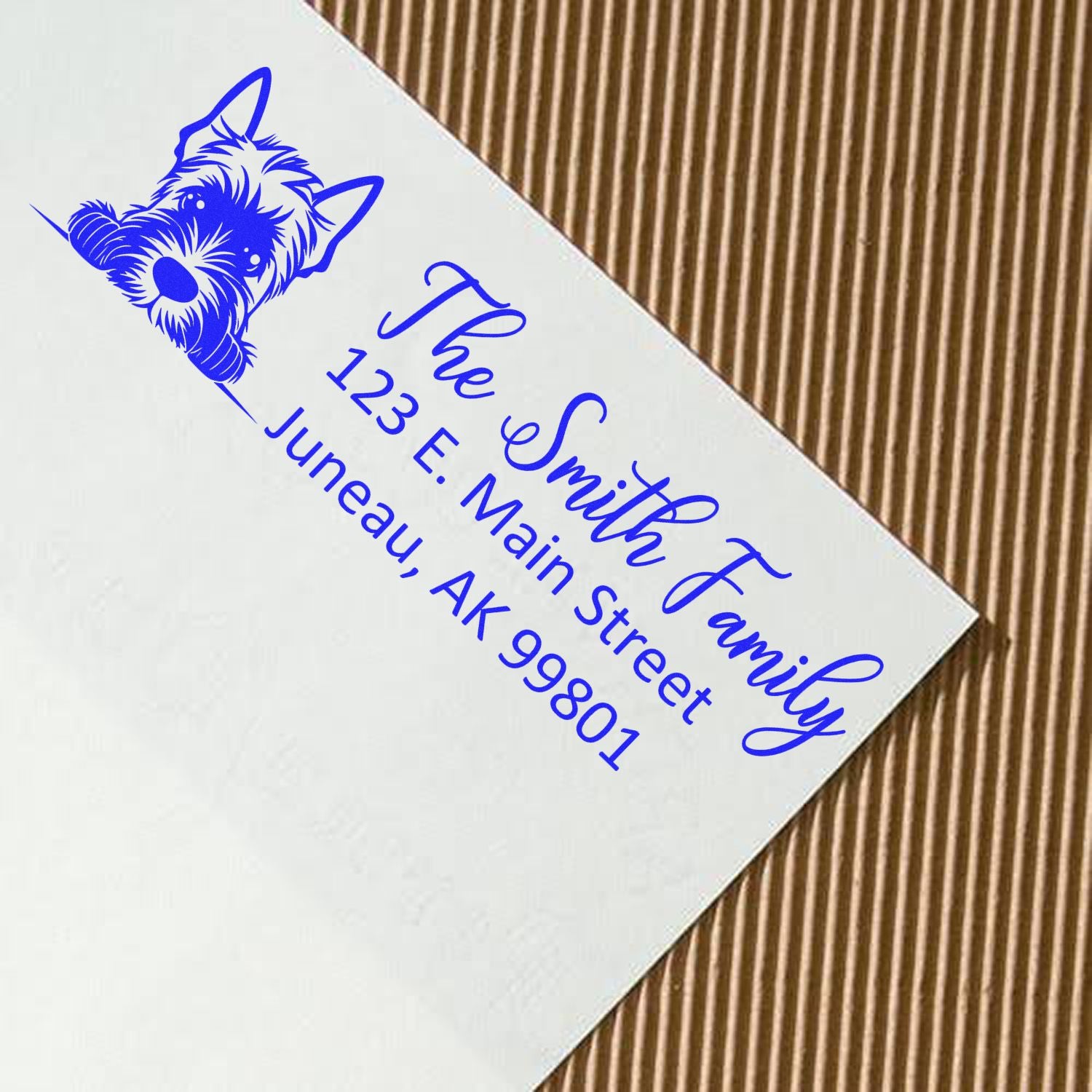 Blue custom return-address stamp with dog logo and The Smith Family on a white card.