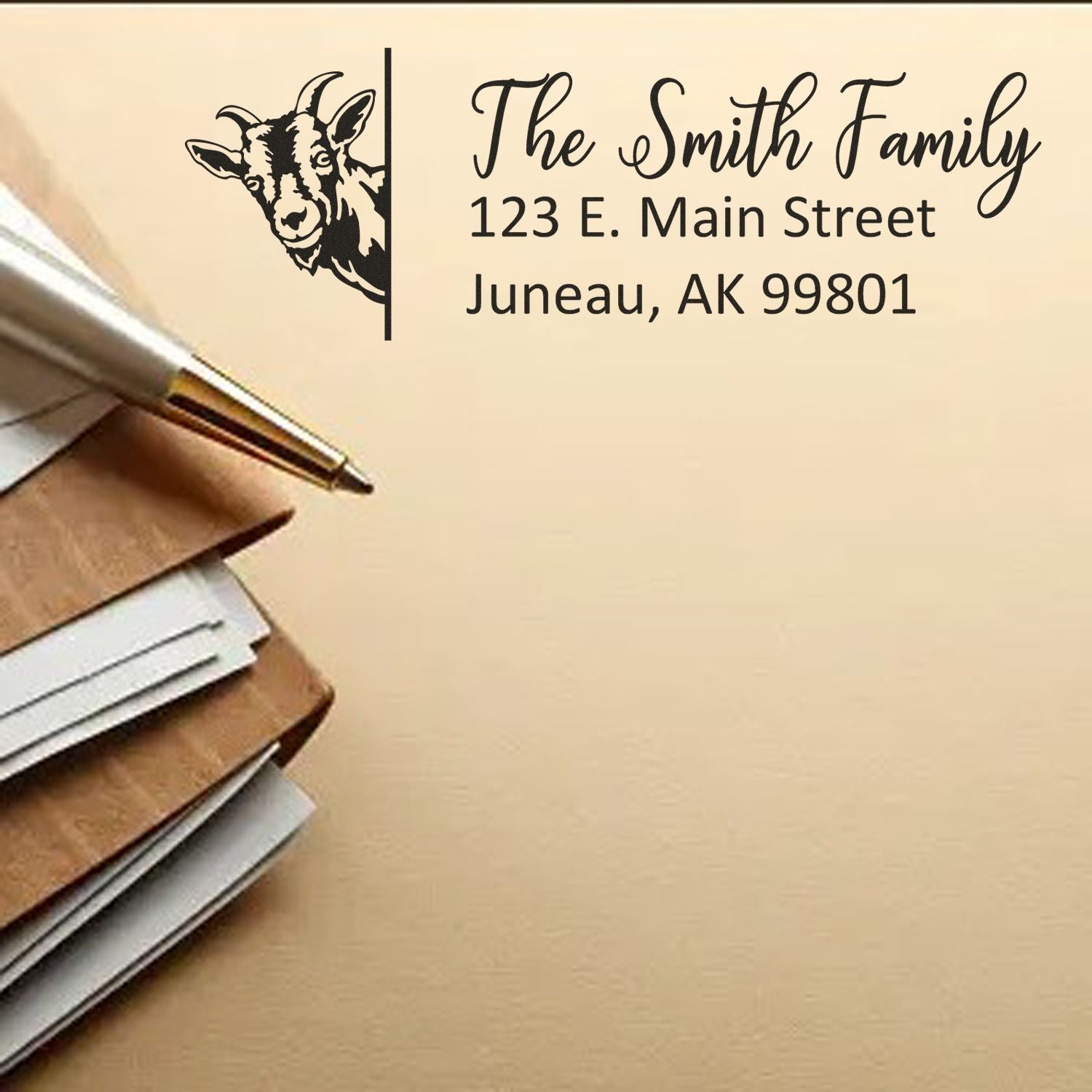 Custom black address stamp and seal with goat graphic, The Smith Family, and Juneau, AK on tan background.