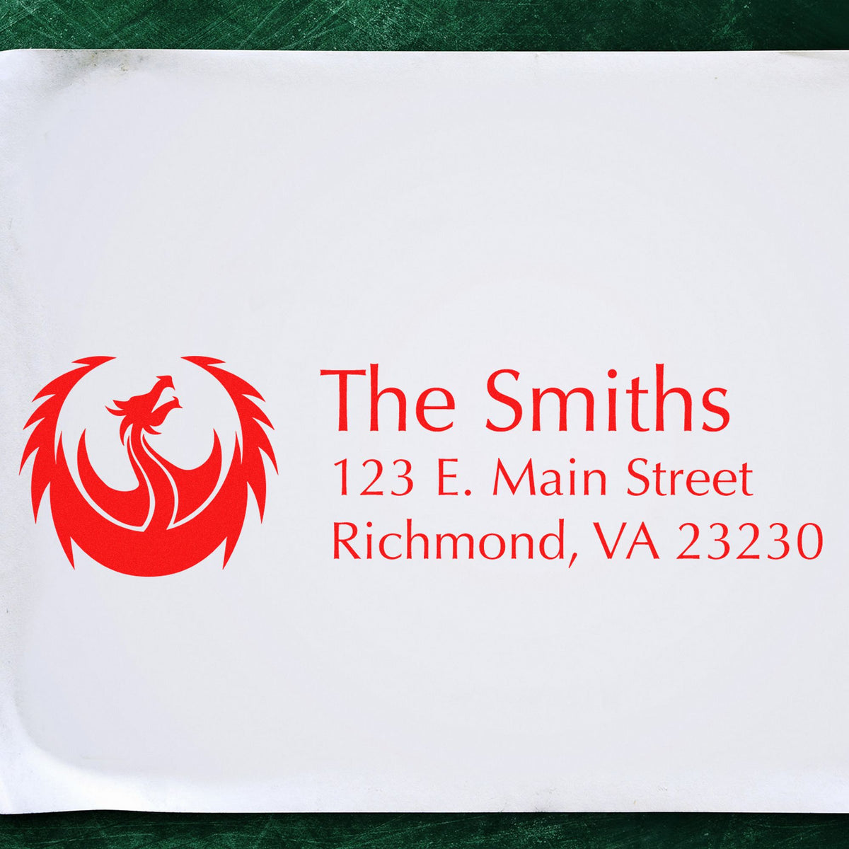 Red custom stamp and seal for The Smiths, with phoenix logo and address on white paper.