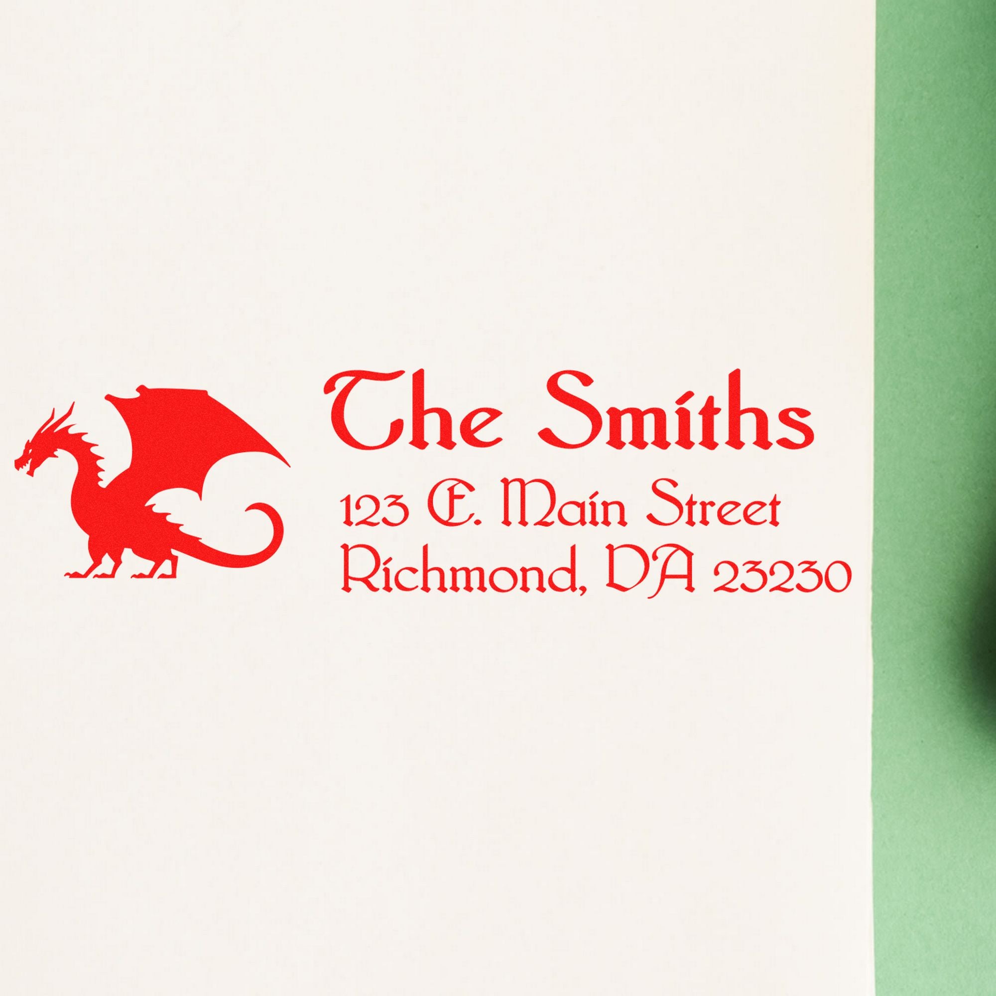 Red dragon seal stamp for The Smiths, with 123 E. Main Street, Richmond, VA 23230 on white paper with green edge.