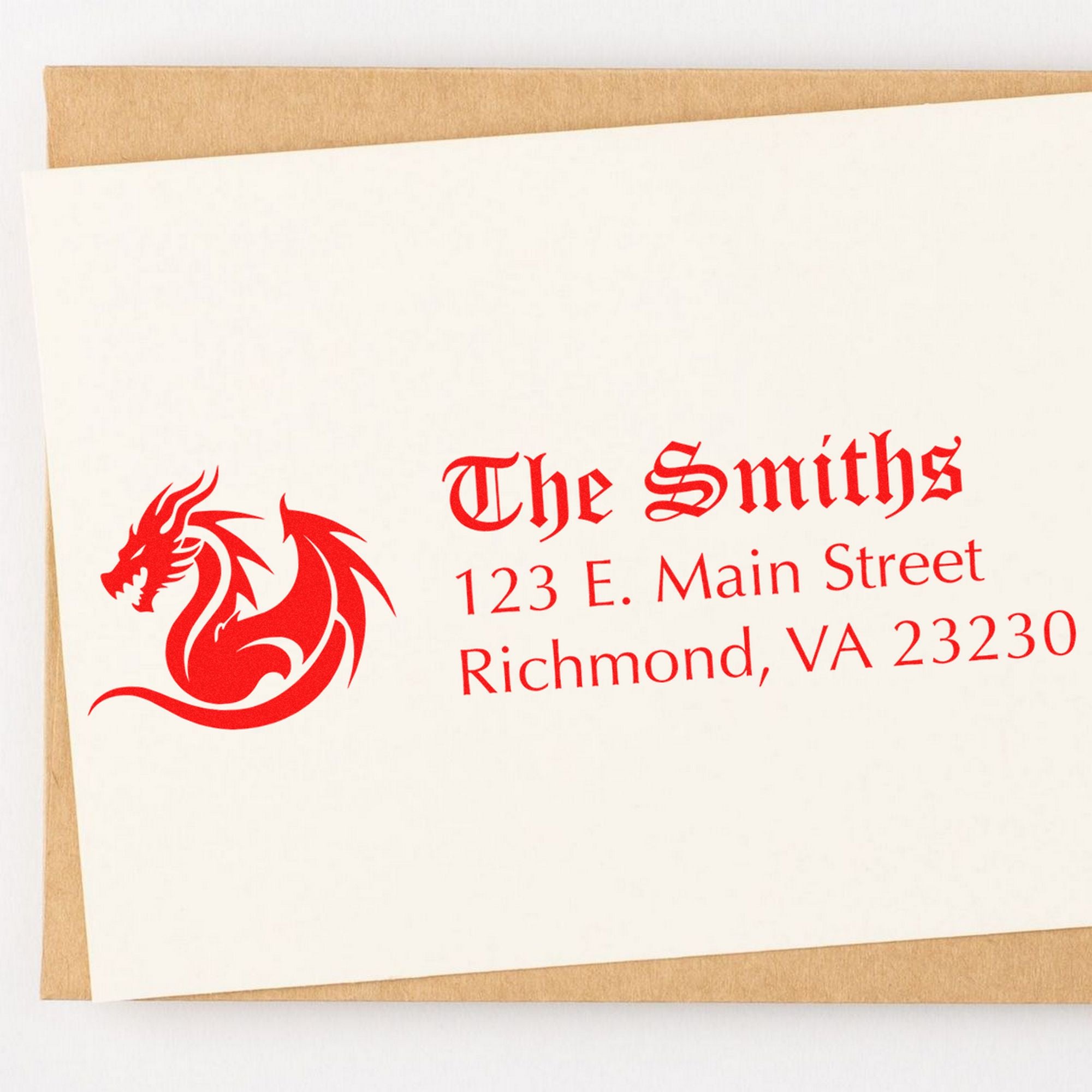 White envelope seal stamp with red dragon logo, The Smiths name, and address on tan paper background.