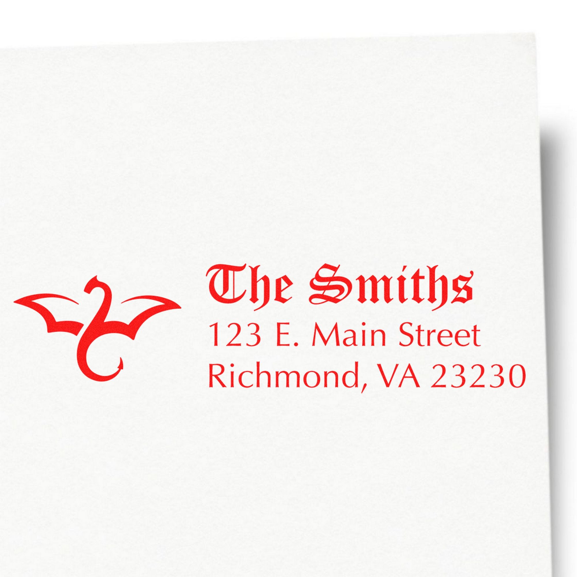 Red custom stamp and seal with ornate monogram, The Smiths, and Richmond, VA address on white paper.