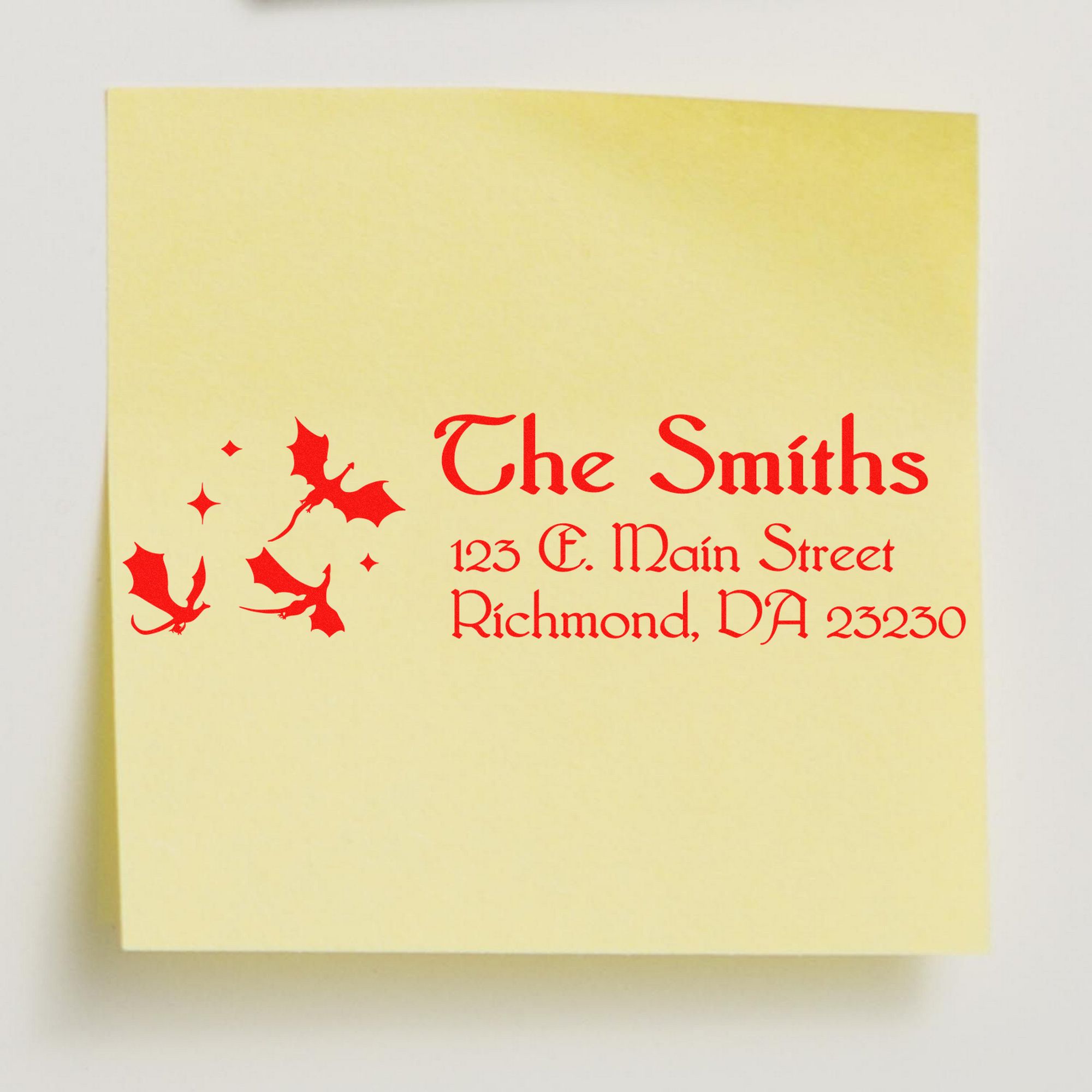 Yellow custom stamp and seal with red gothic text, holly seals, and address for The Smiths, Richmond, VA 23230.