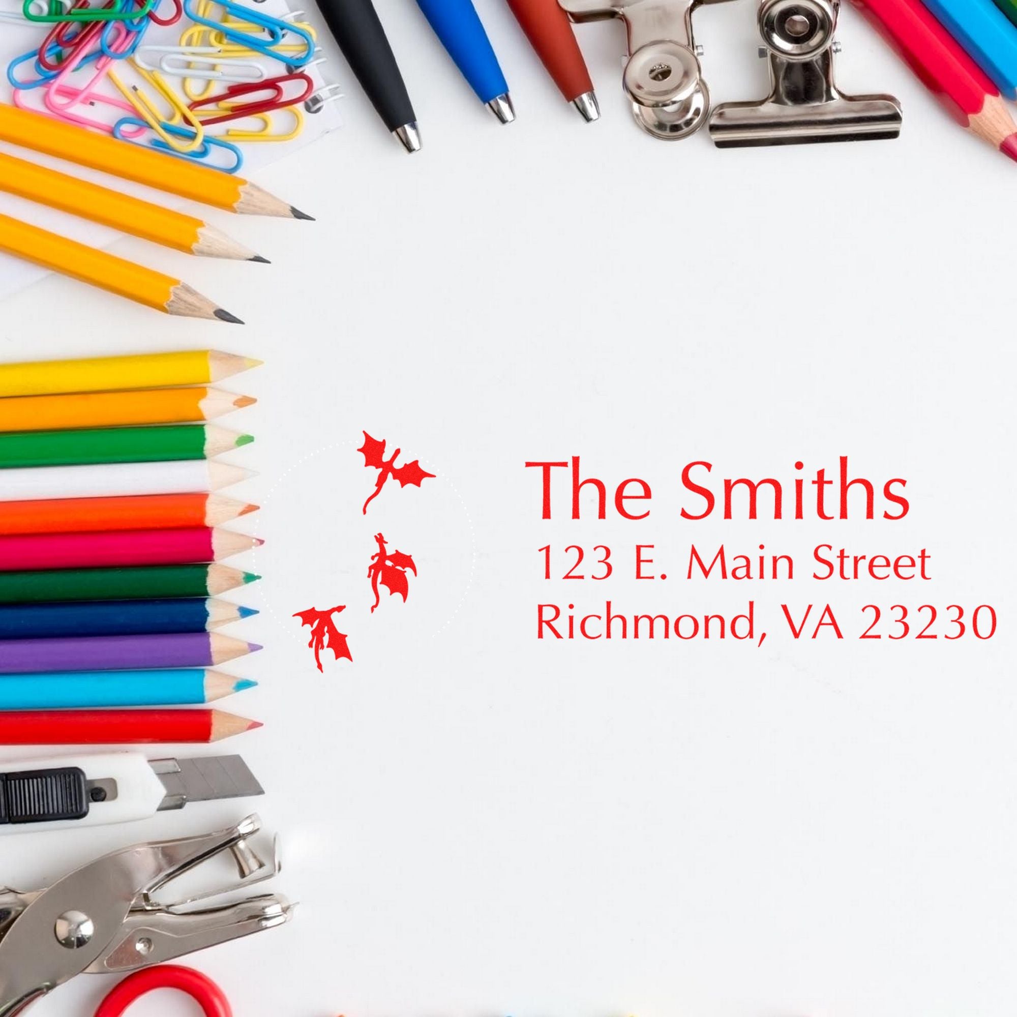Colorful stationery border with custom red address stamp and seal for The Smiths, featuring pencils, paper clips, and binder clips.
