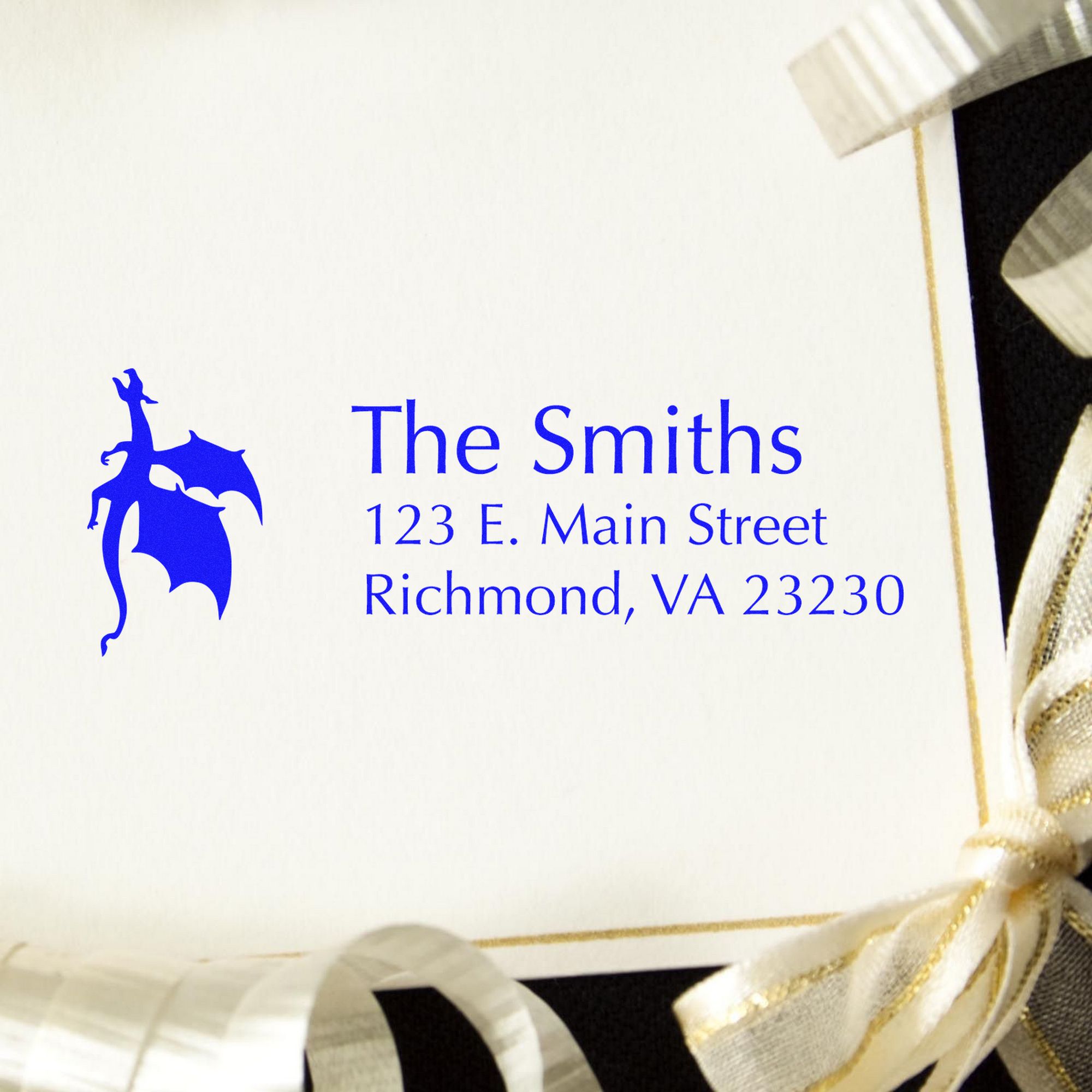 Blue custom stamp and seal card for The Smiths, featuring address and white-gold ribbon accents.